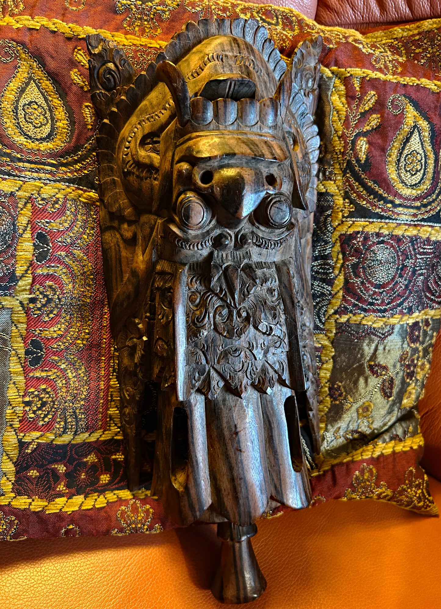 Close-up of the carved crown, beak and eyes of the Balinese Garuda figure