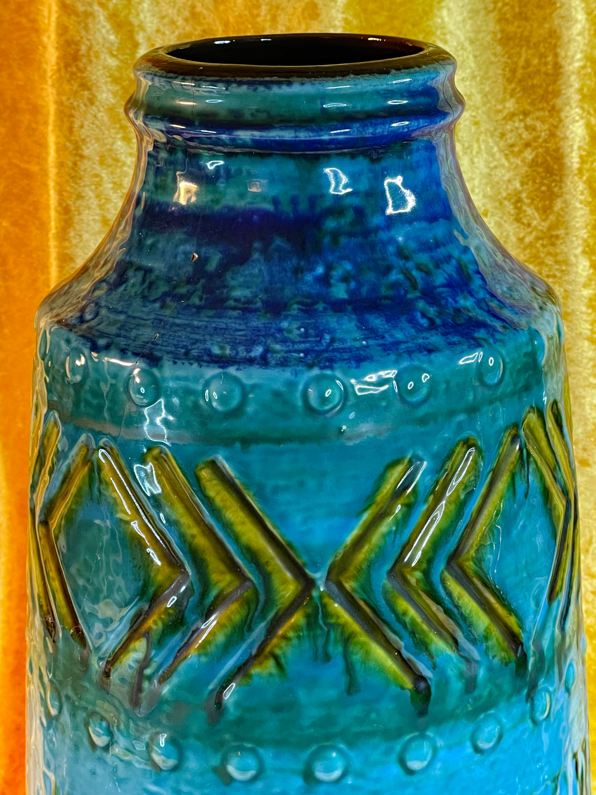 Detail of incised chevron and diamond relief with olive glaze accents