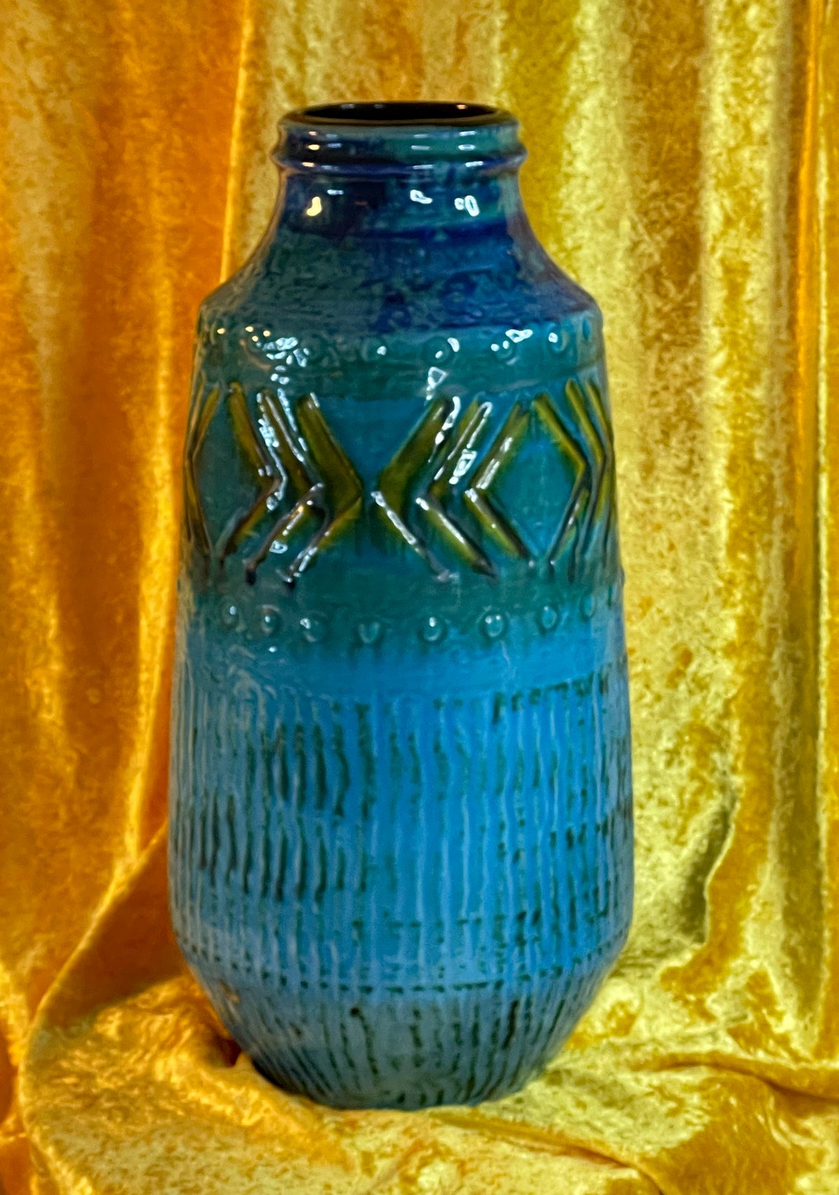 Full view of turquoise blue floor vase with dotted borders and ribbed lower body