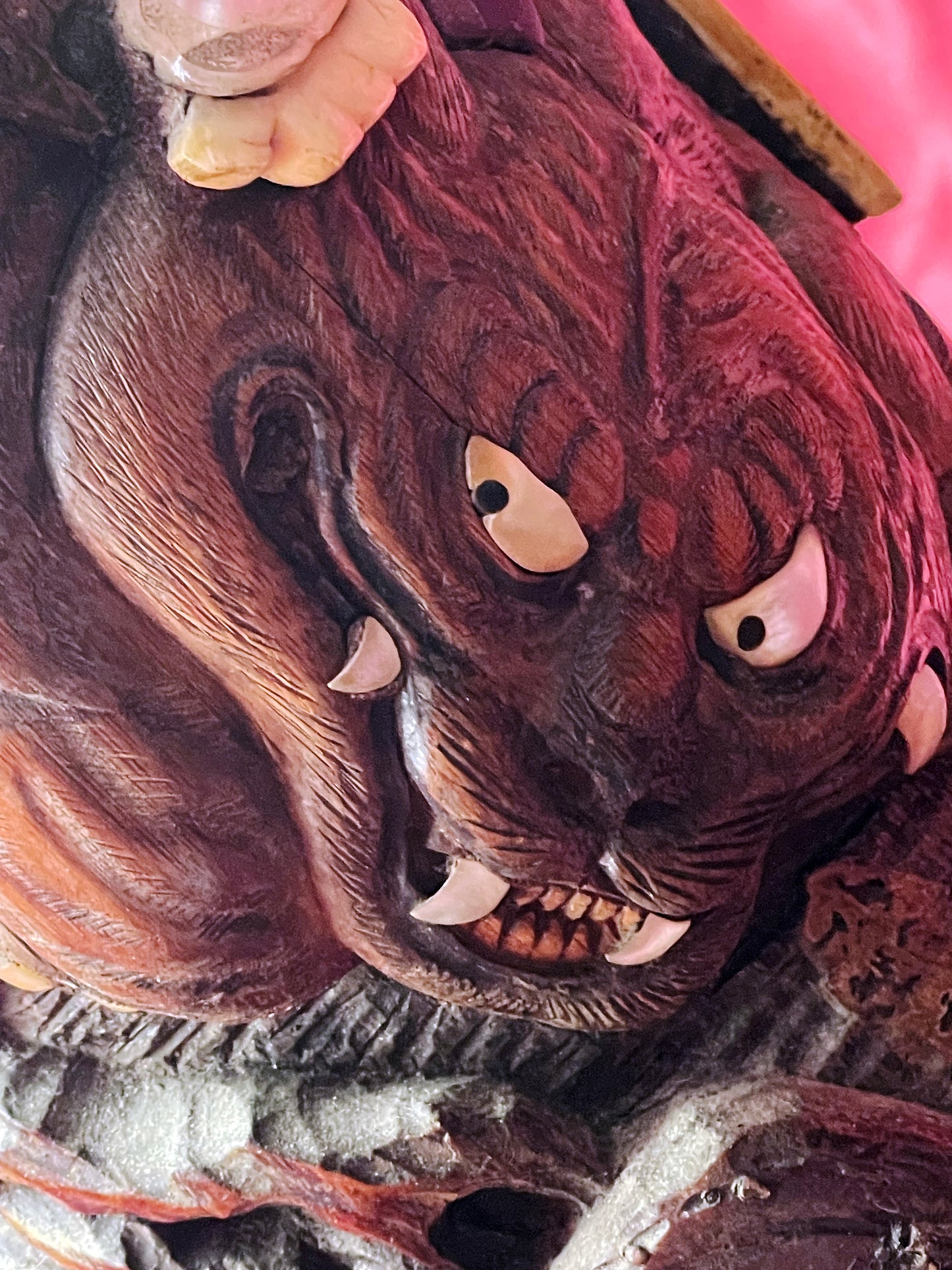 Carved beast face with mother of pearl eyes on Japanese hardwood butter cask