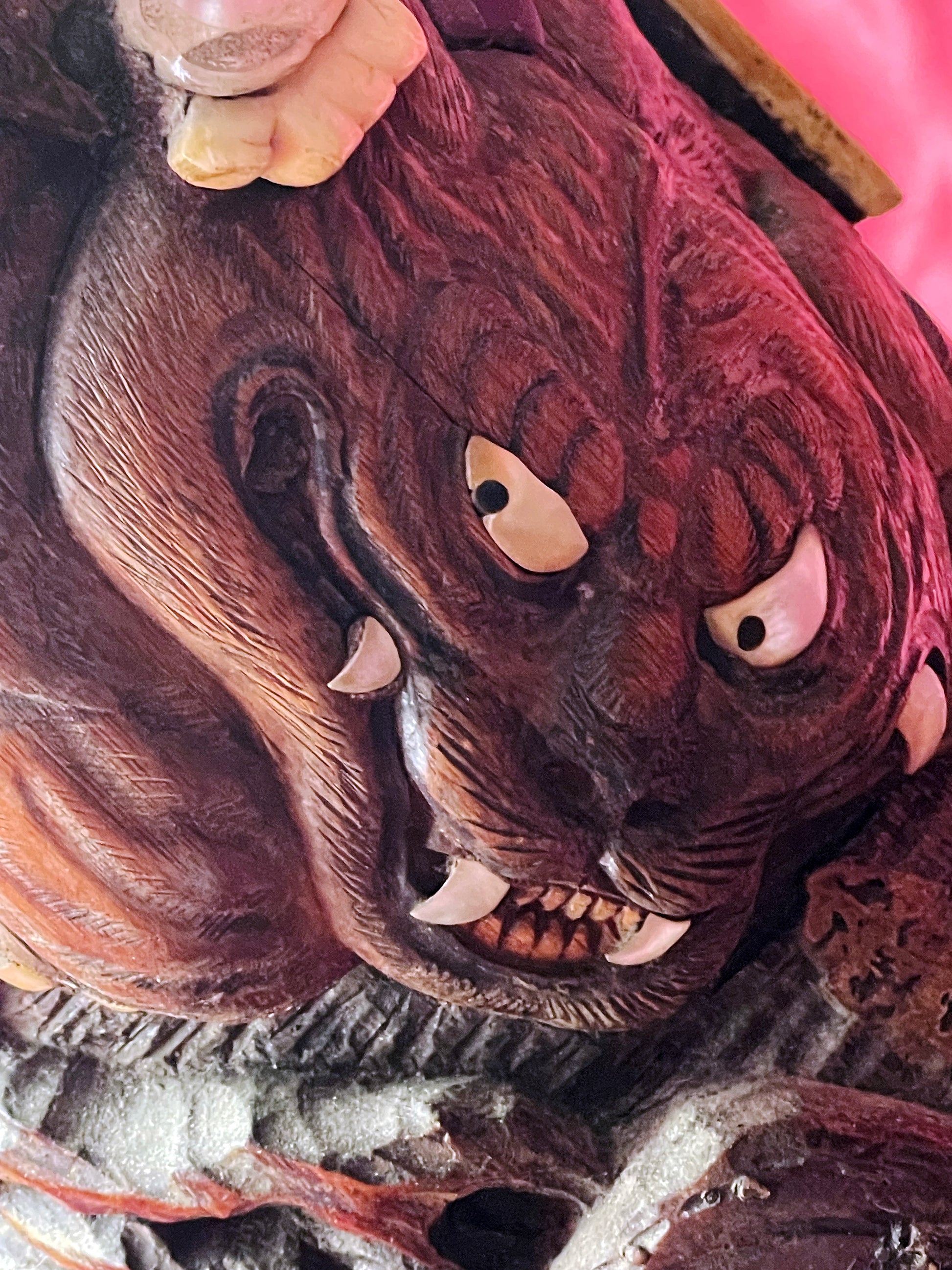 Carved beast face with mother of pearl eyes on Japanese hardwood butter cask
