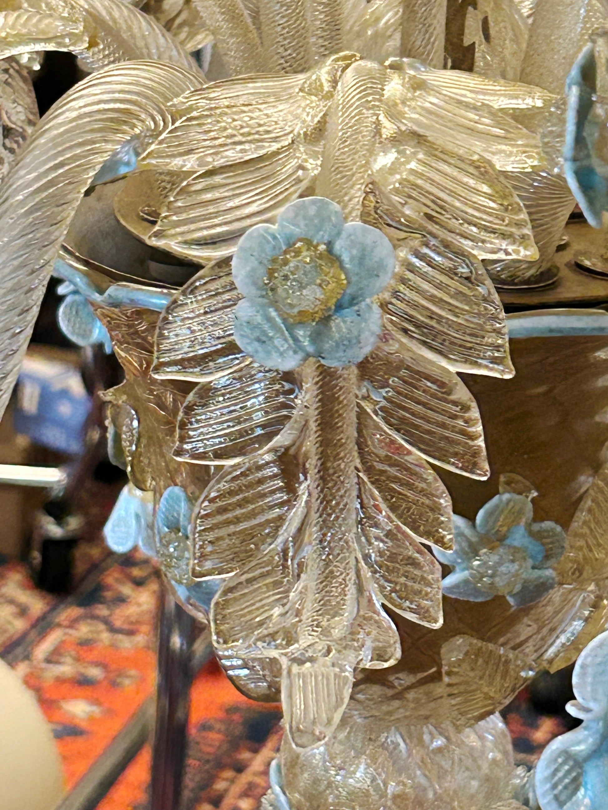 Macro of a hand formed blue Murano glass flower