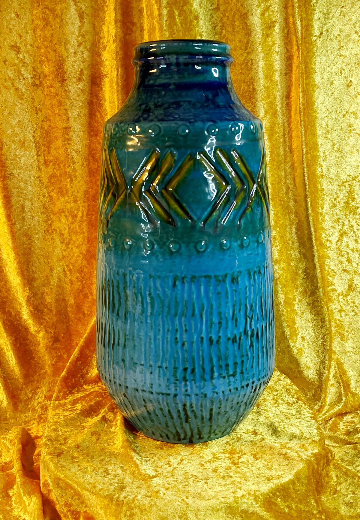 Turquoise floor vase, alternate full view under warm light