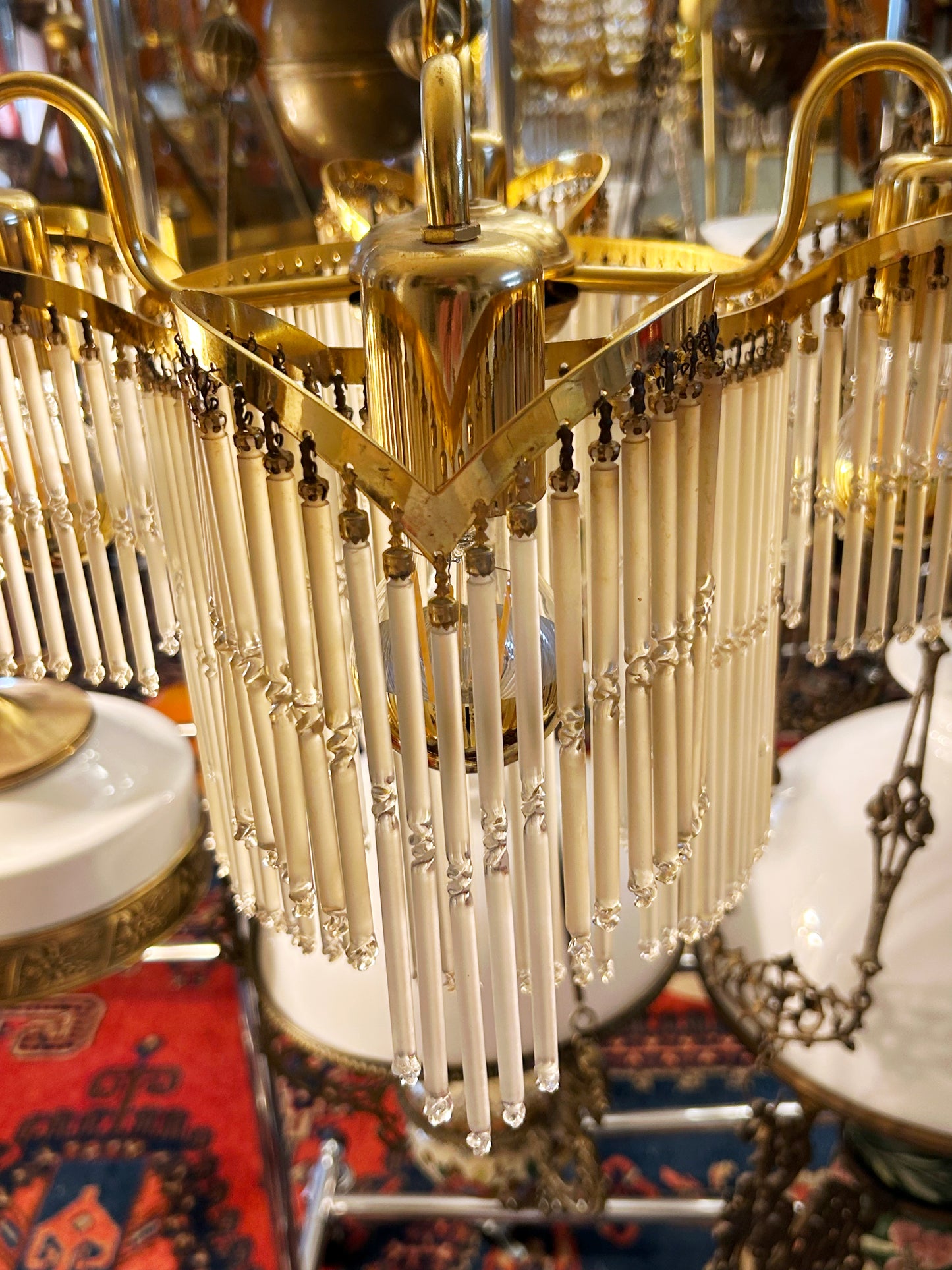 Close detail of the brass V-frame and vertical glass rods