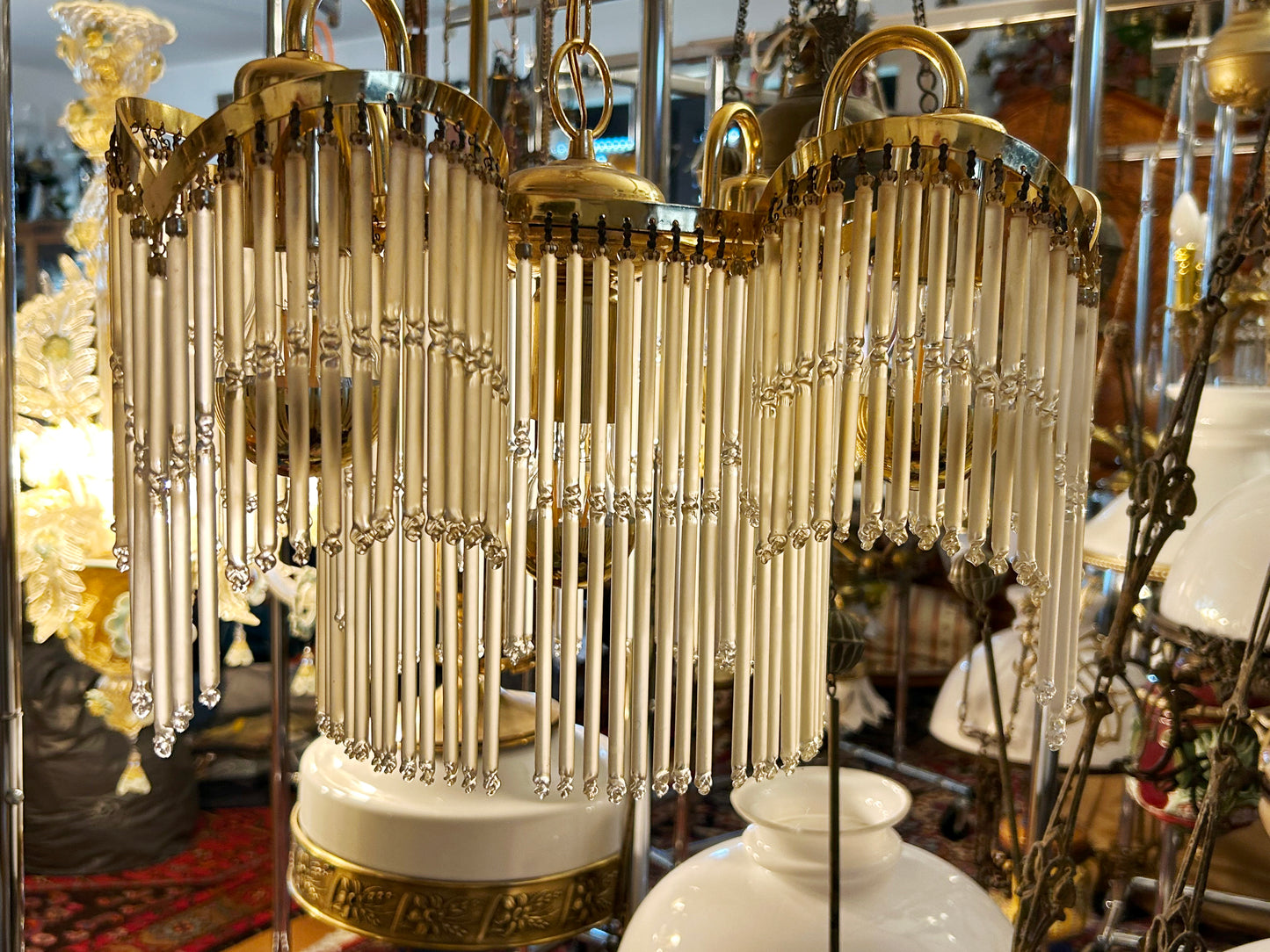 Close detail of cascading glass-rod swags with faceted crystal drops