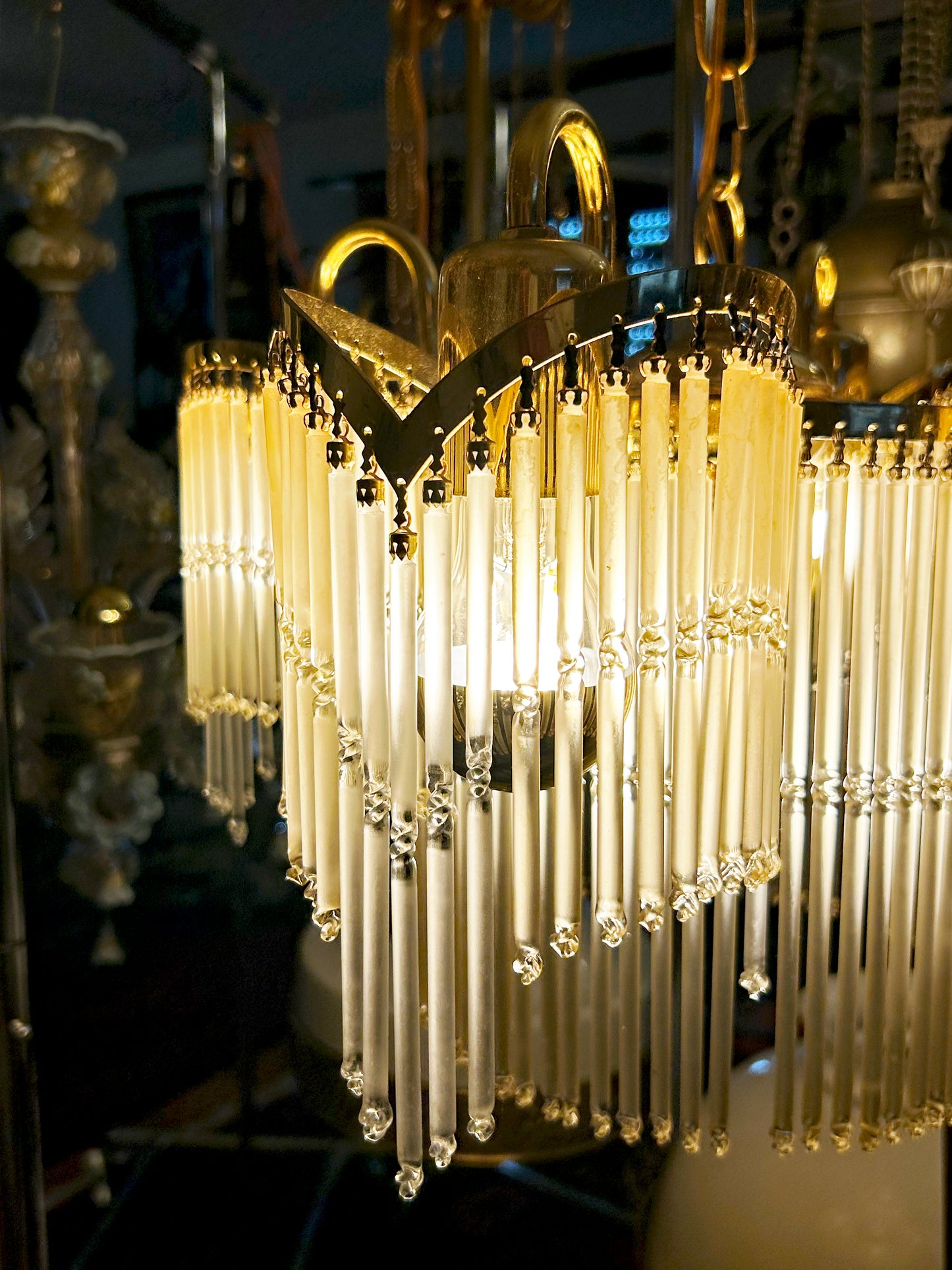 Art Nouveau Jugendstil crystal glass-rod chandelier illuminated, glowing cream rods and brass frame