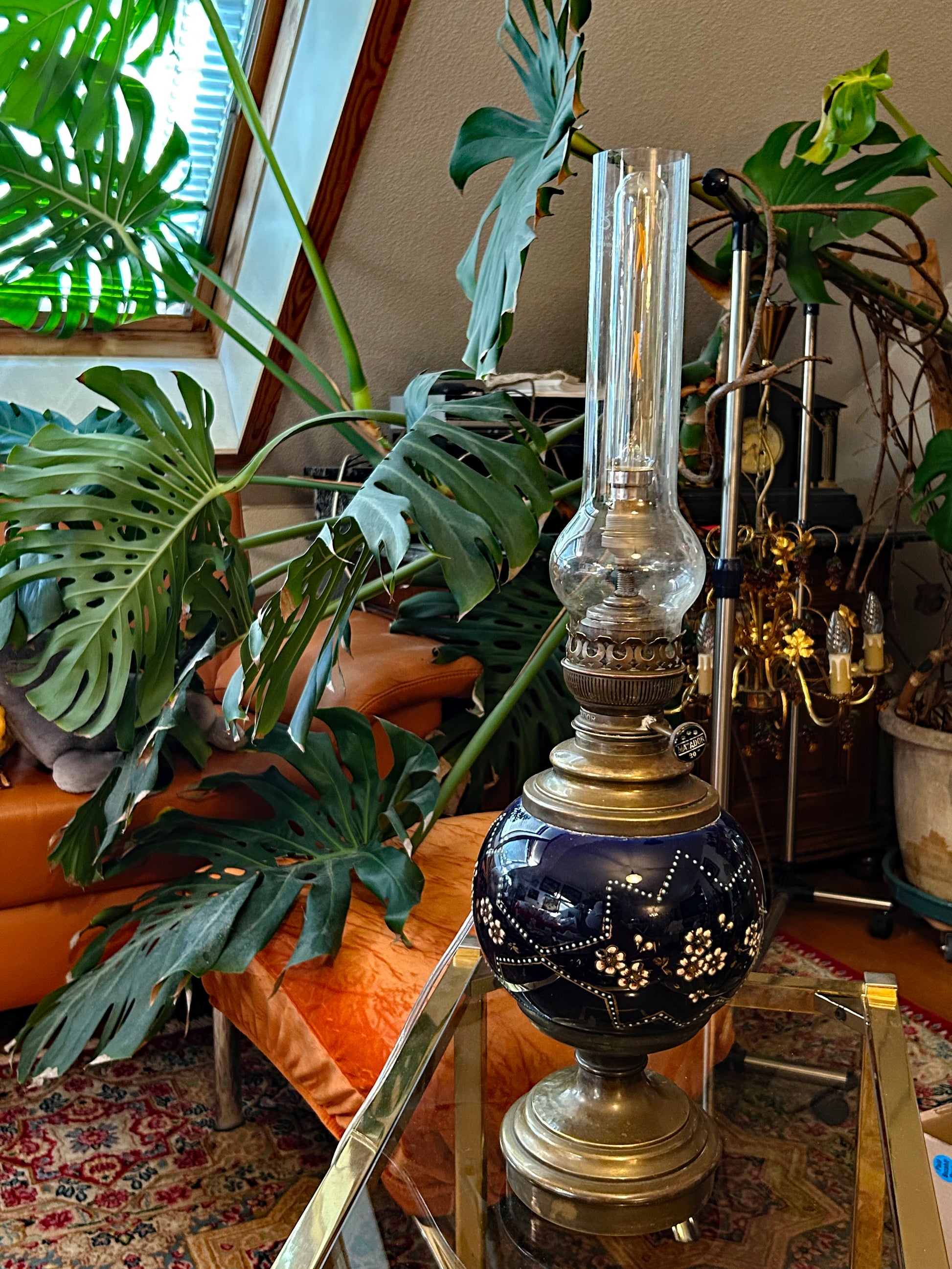 Antique cobalt blue cloisonné enamel oil lamp electrified with tall glass chimney, illuminated