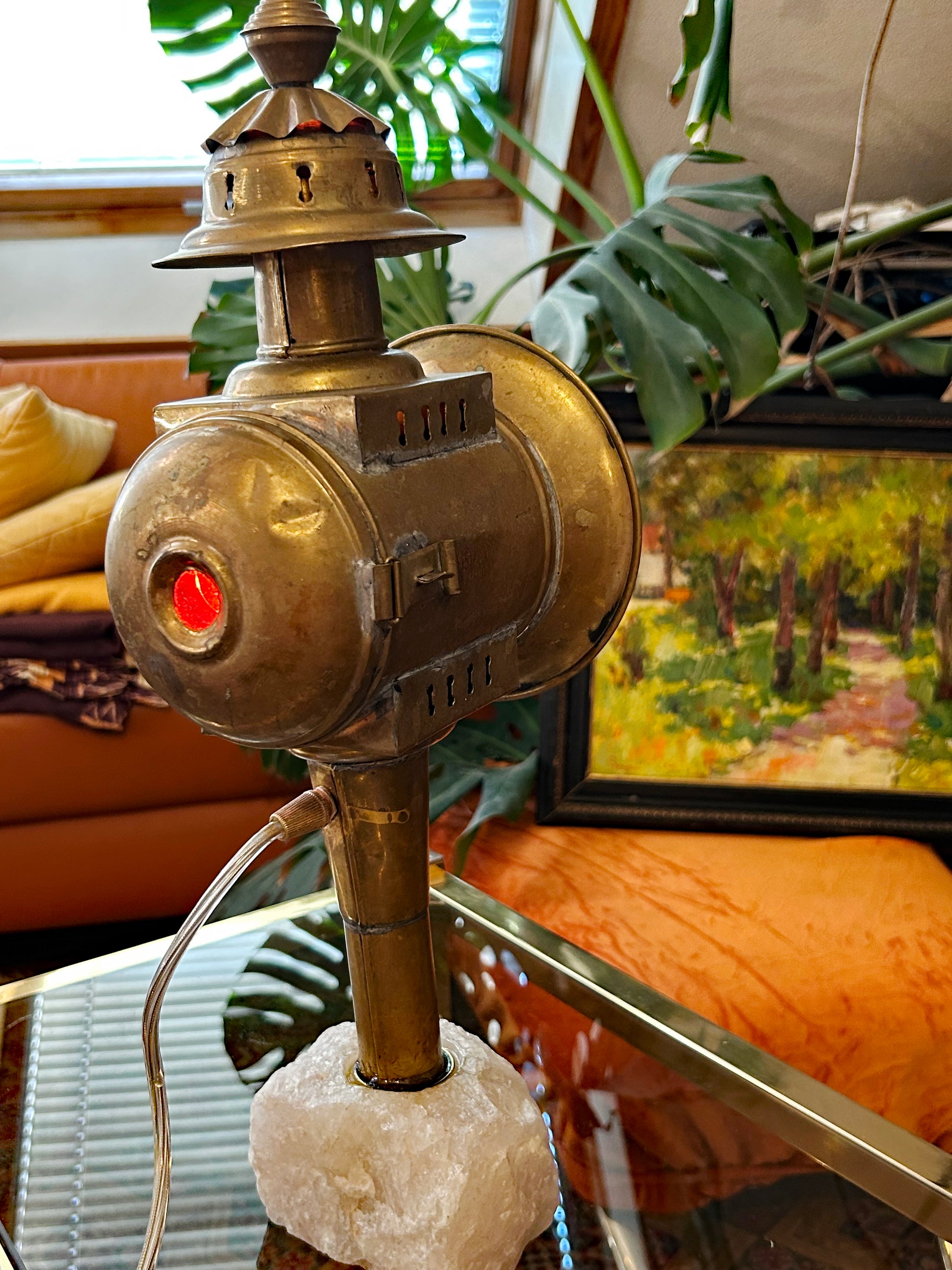 Rear and side view of the carriage lamp showing red signal jewel and brass body