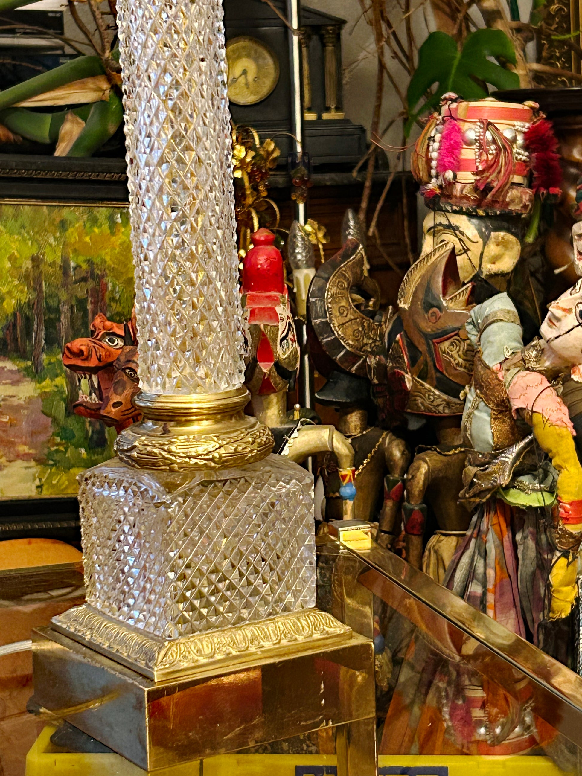 Diamond-cut crystal column with gilt brass collar above the crystal plinth
