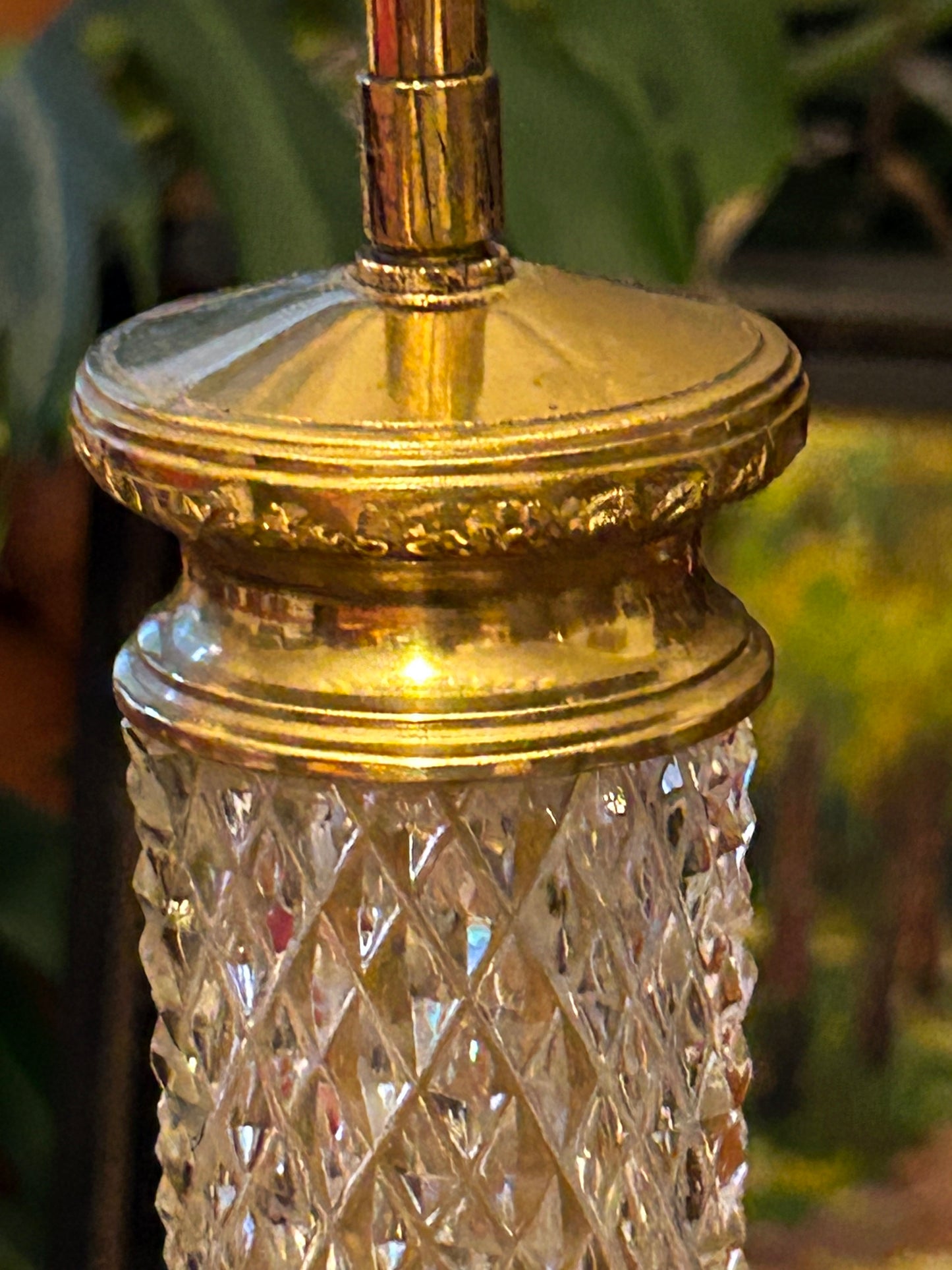 Chased gilt brass collar detail at the top of the crystal column