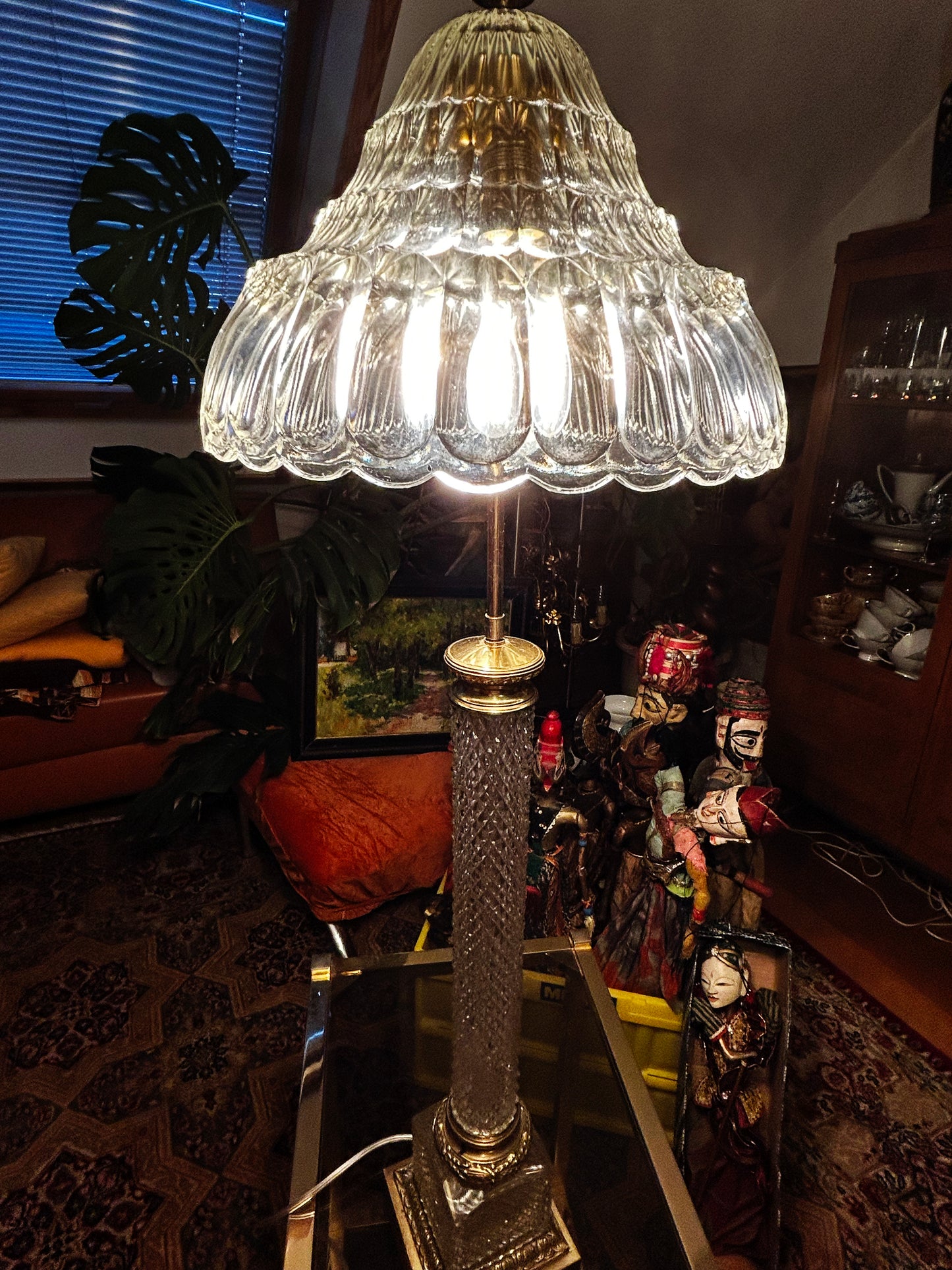 Crystal pillar lamp illuminated, showing the sparkle of the lit crystal shade