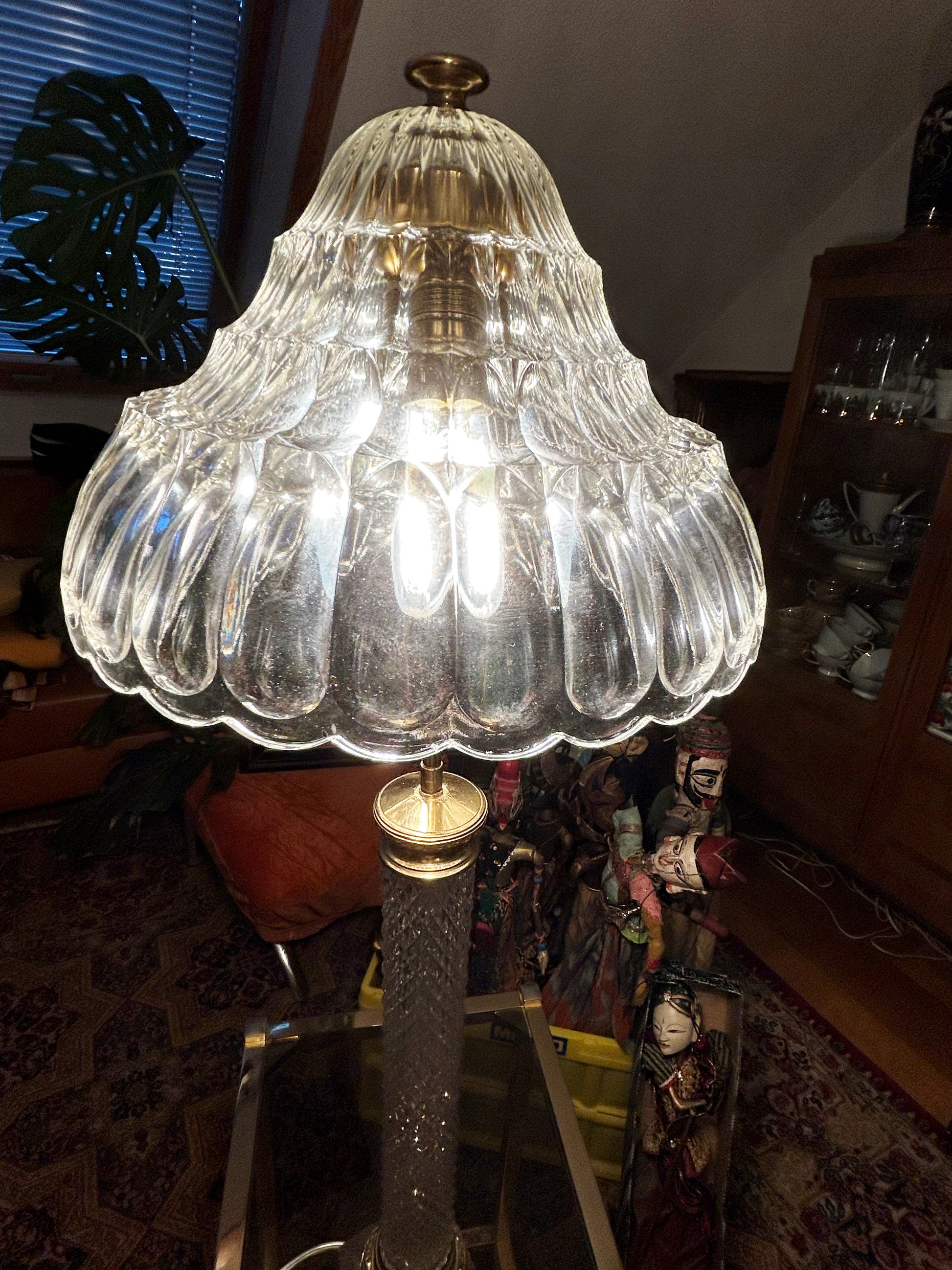 Scalloped crystal dome shade lit from within, glittering facets