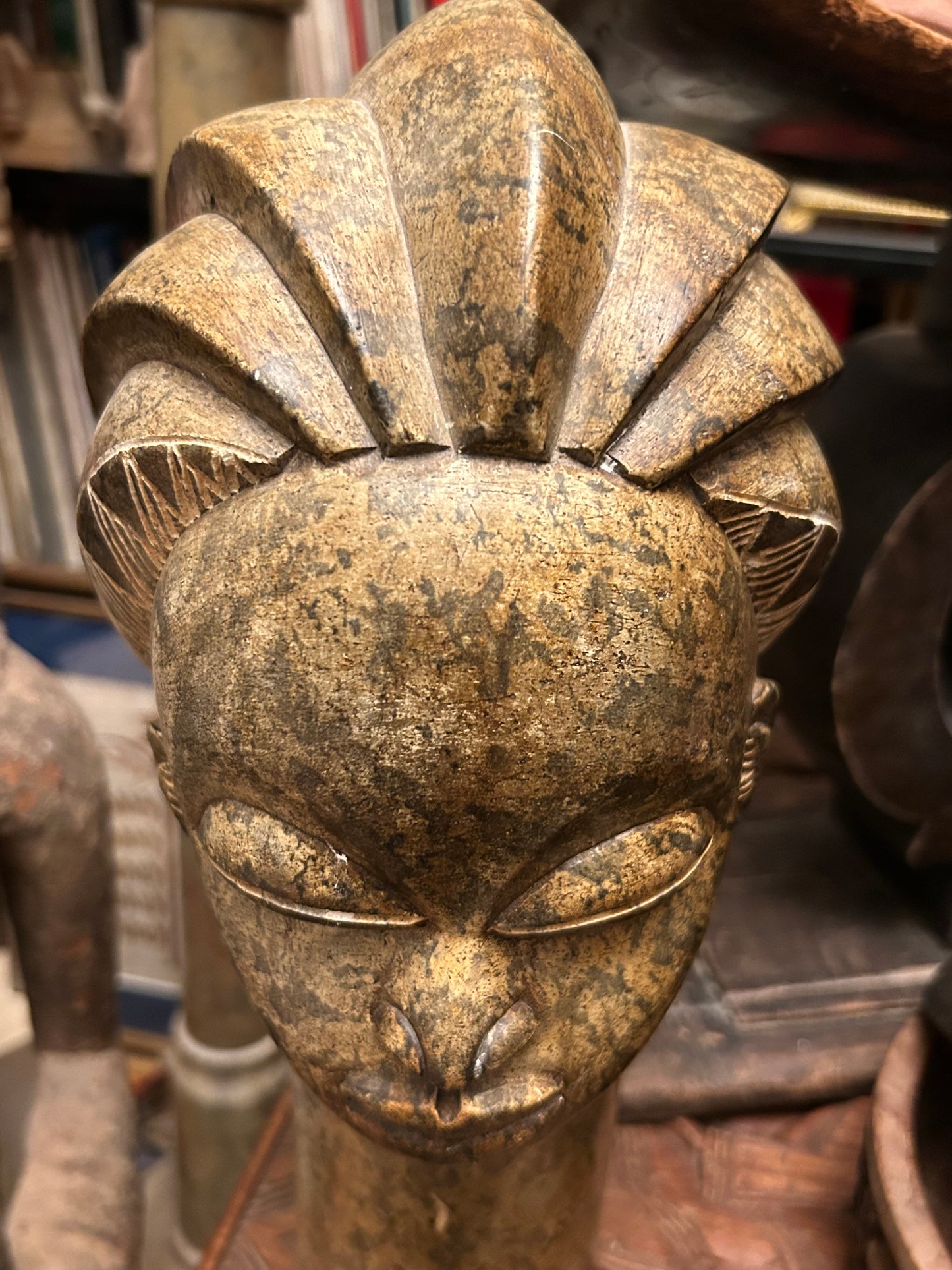 Top view of the carved stone head showing the lobed braided crown headdress