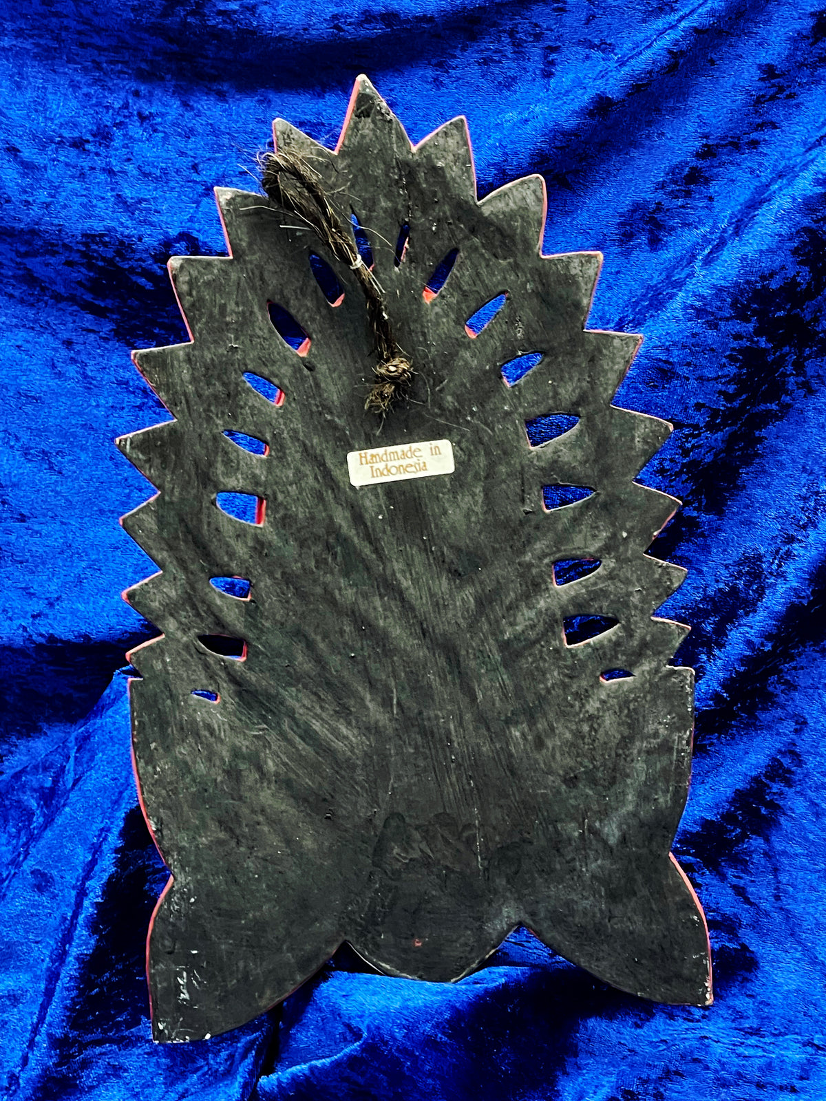Further detail of the polychrome and gilded Balinese goddess wall mask from Indonesia