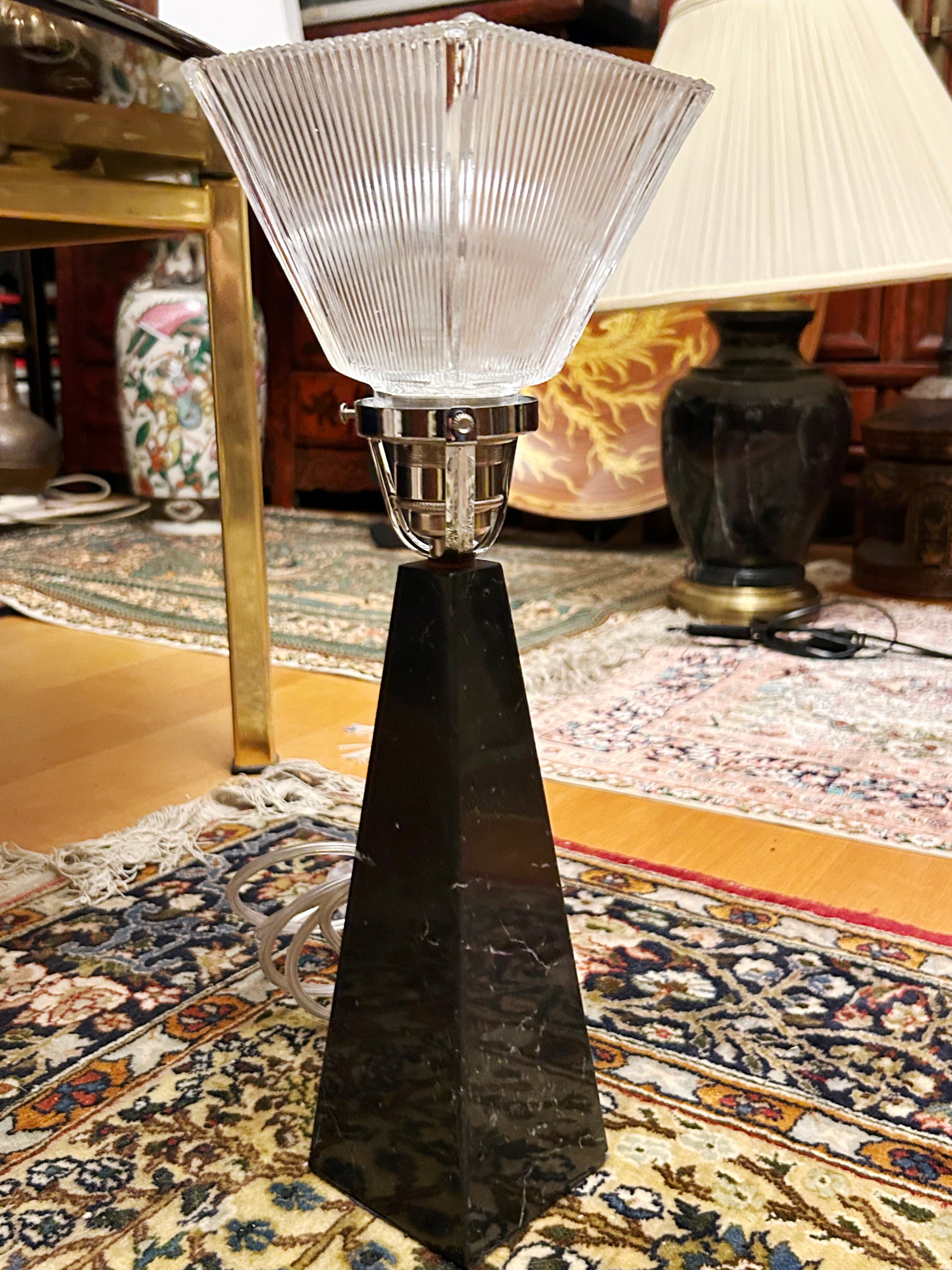 Full view of the black marble obelisk lamp with square Holophane glass shade