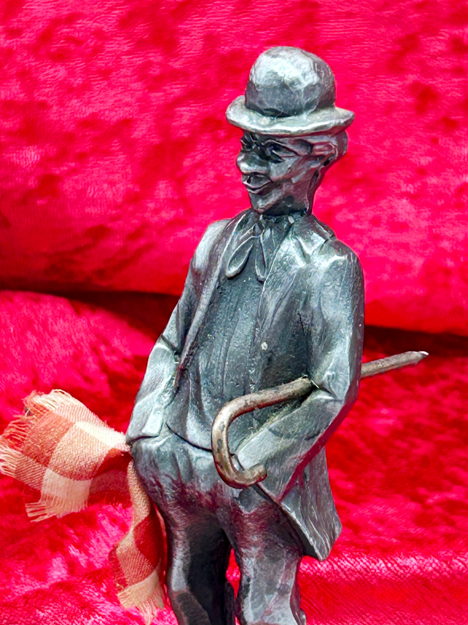 Close-up of Chaplin figure upper body, bowler hat and face detailing