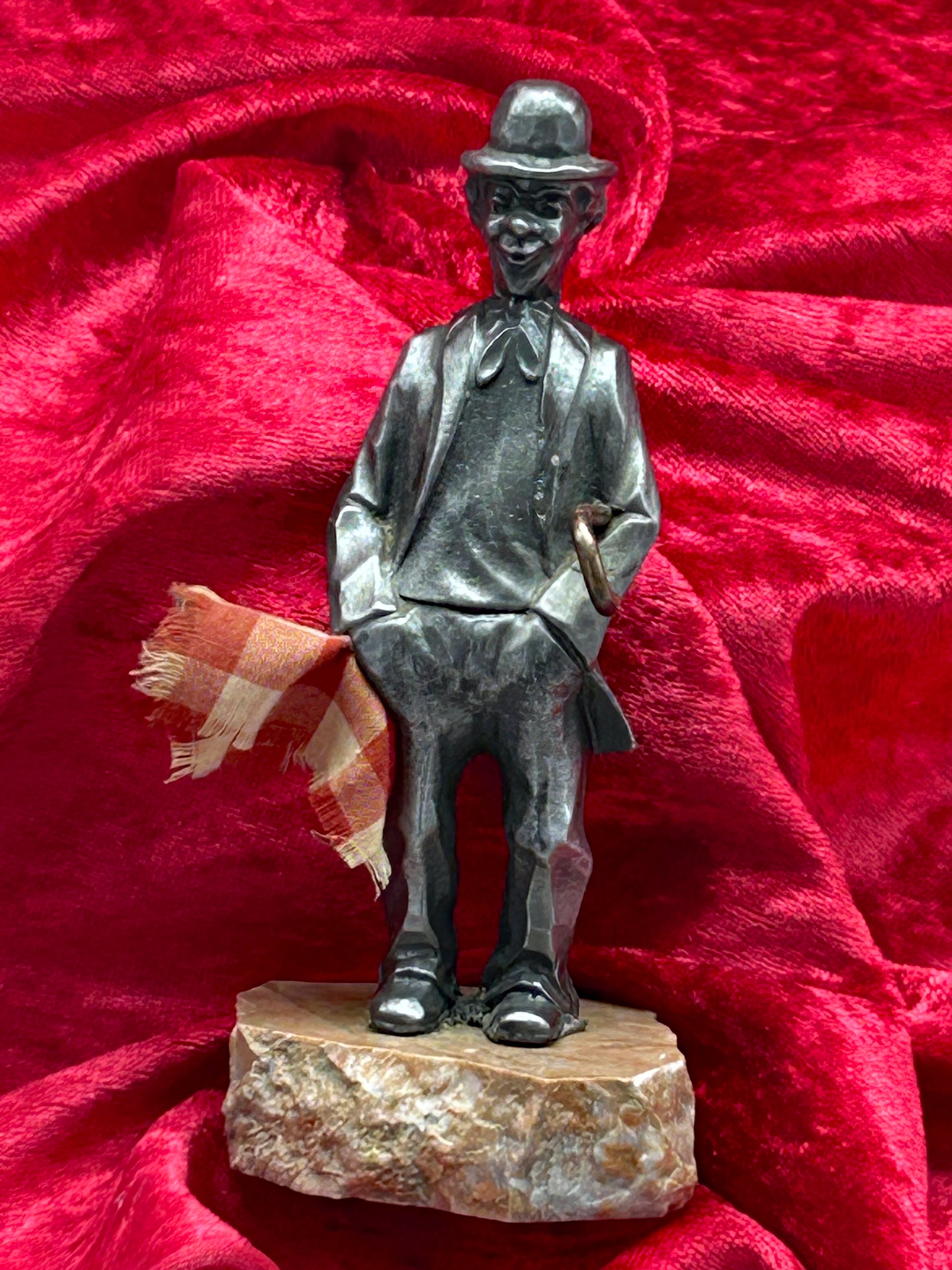 Silvered metal Charlie Chaplin figure on marble base, full front view