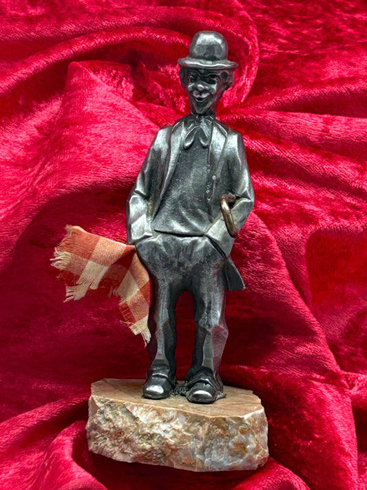 Silvered metal Charlie Chaplin figure on marble base, full front view