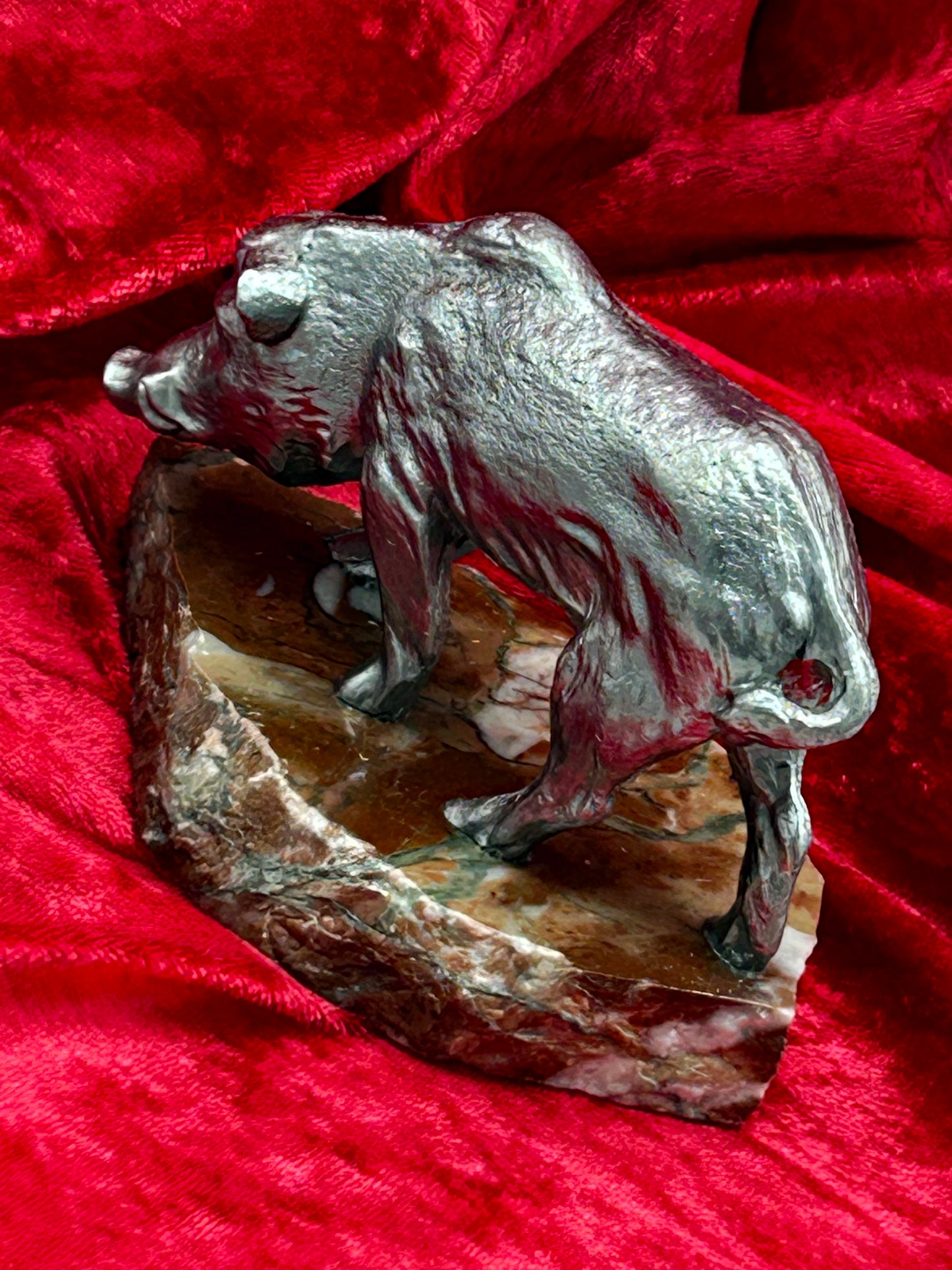 Silvered metal wild boar figure three quarter view showing marble base