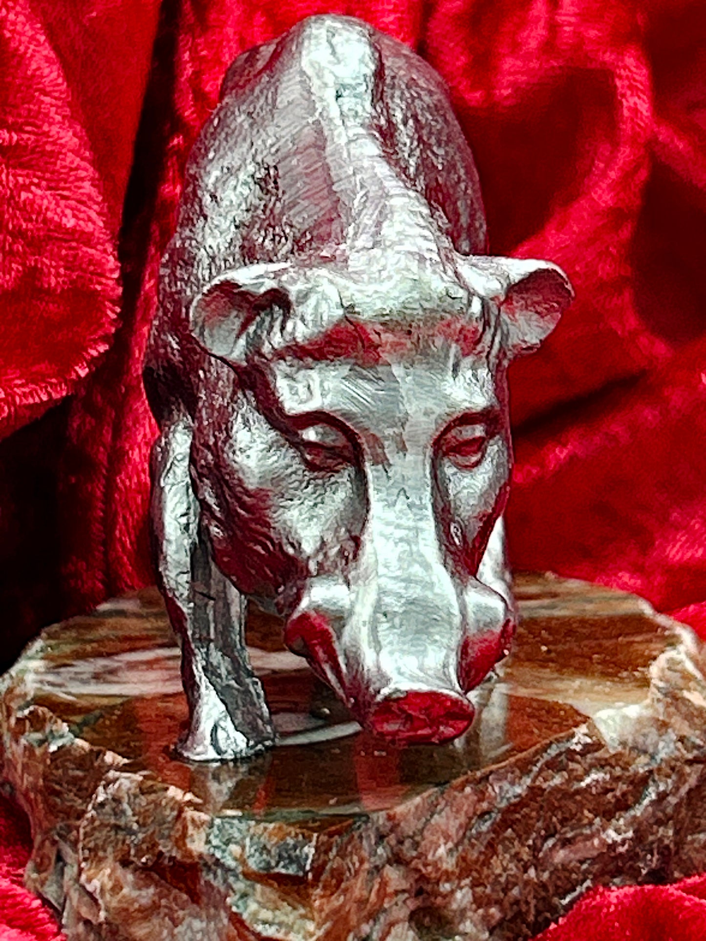 Close up front detail of silvered boar face, snout, eyes and ears