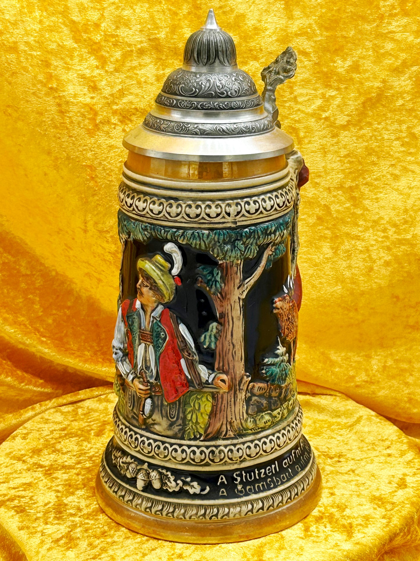 German hunting beer stein full front view with pewter lid closed showing hunter and forest relief