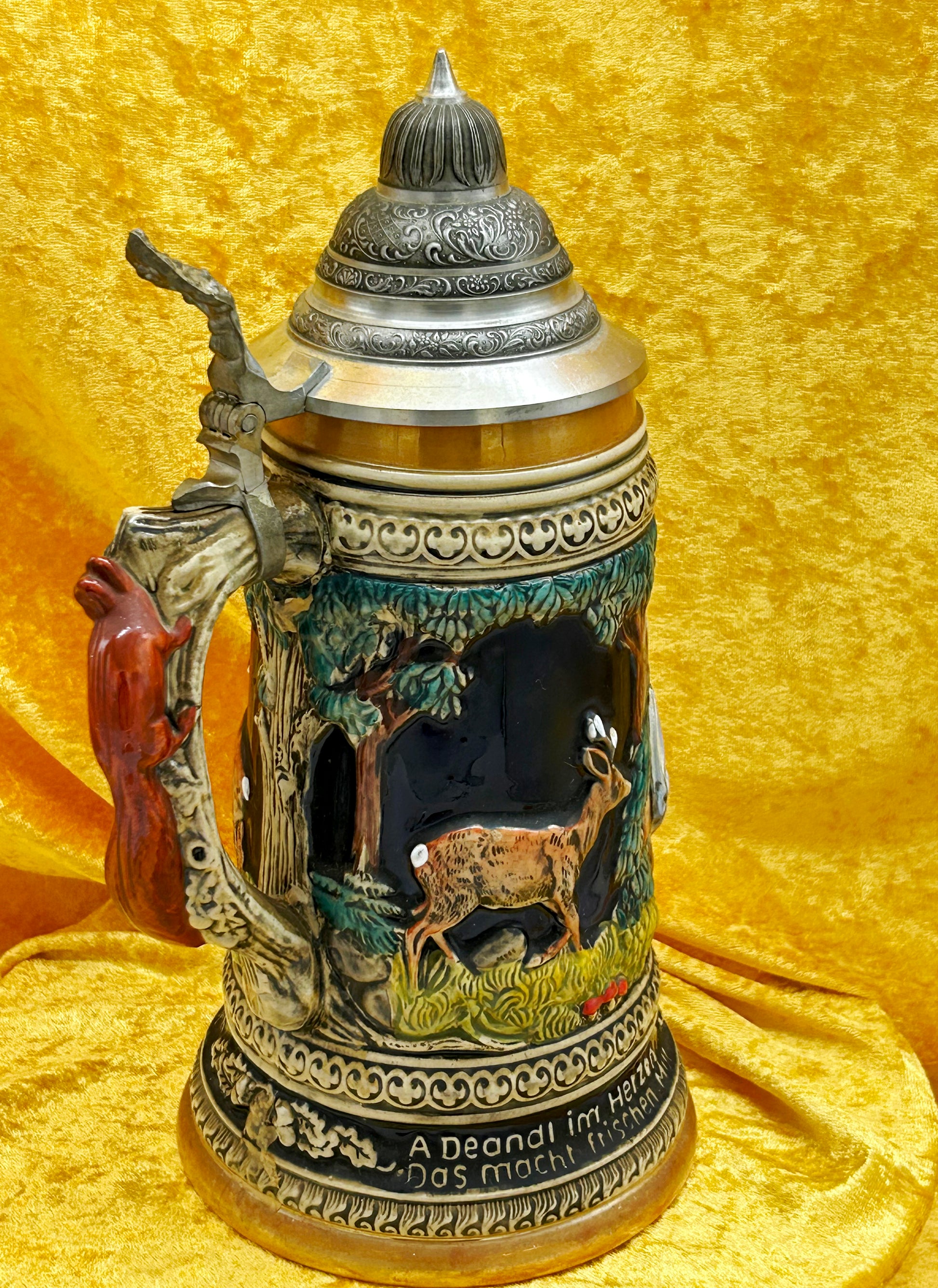Beer stein side panel with hand-painted deer and Bavarian dialect inscription band