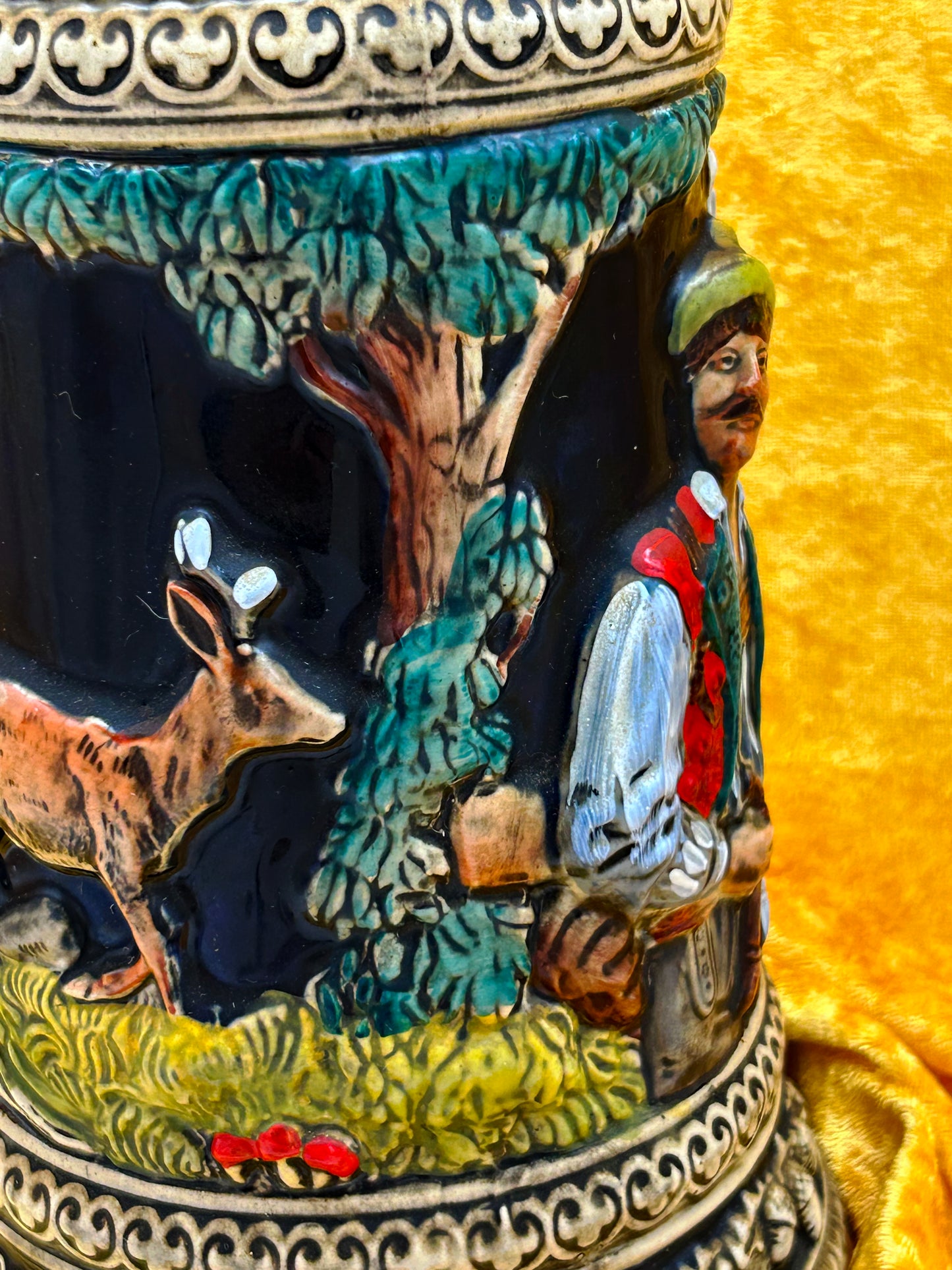 Close-up panel detail of deer and hunter in a forest clearing