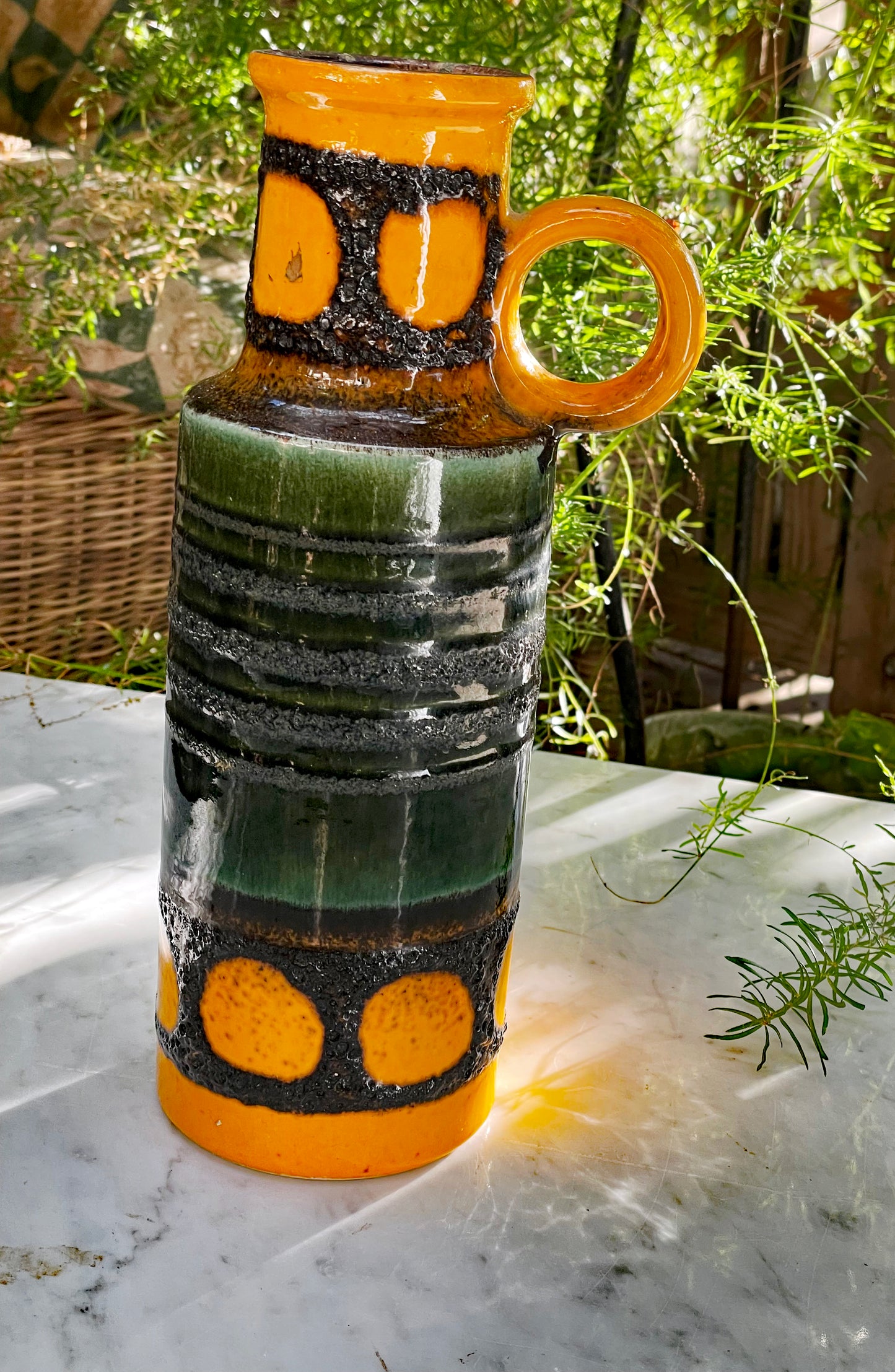 Fat Lava ceramic vase full front view with green banded body and orange base