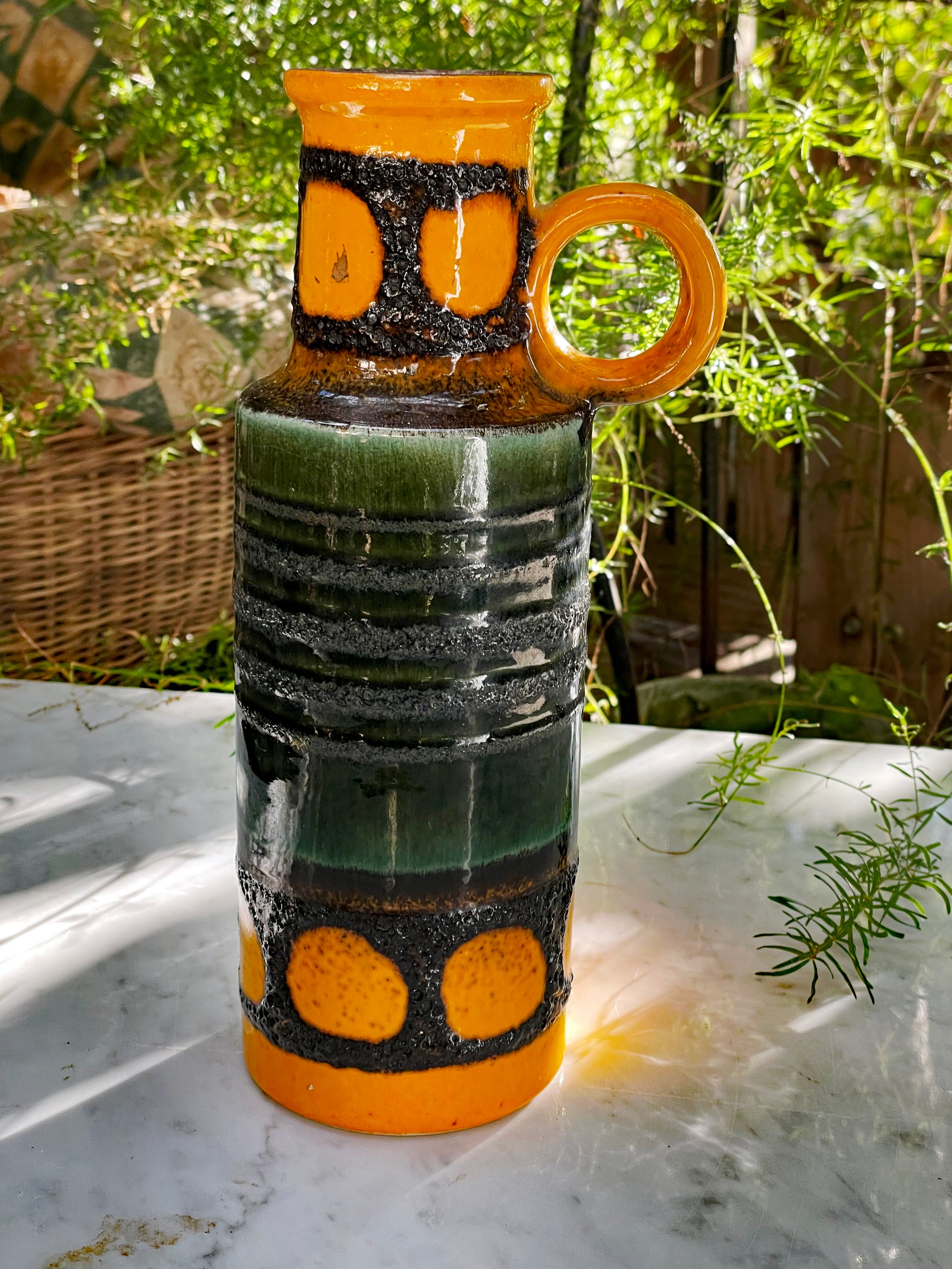 West German Fat Lava handled vase, orange and green glaze, three-quarter view