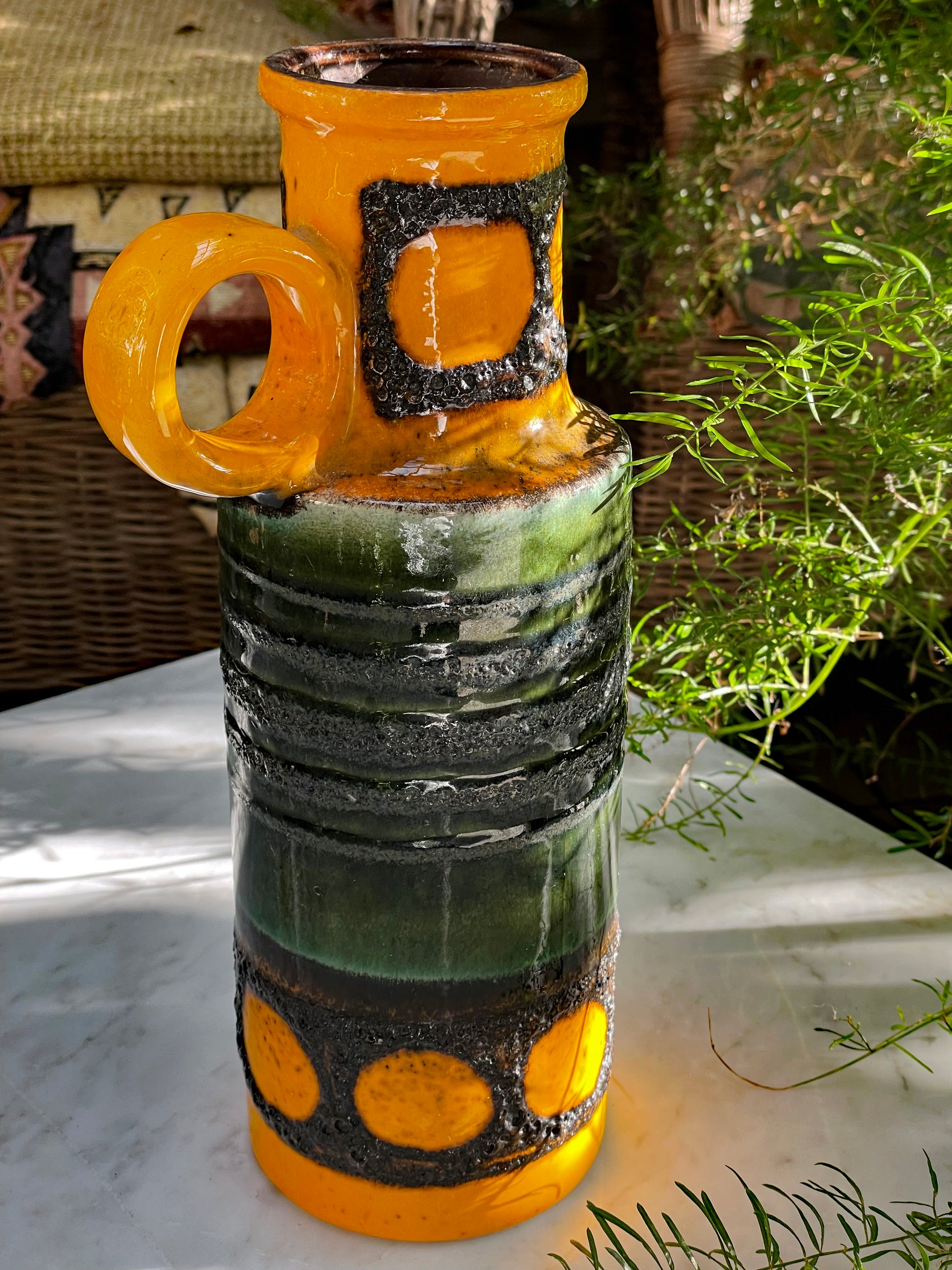 West German vase side view showing loop handle and amber spotted lava glaze