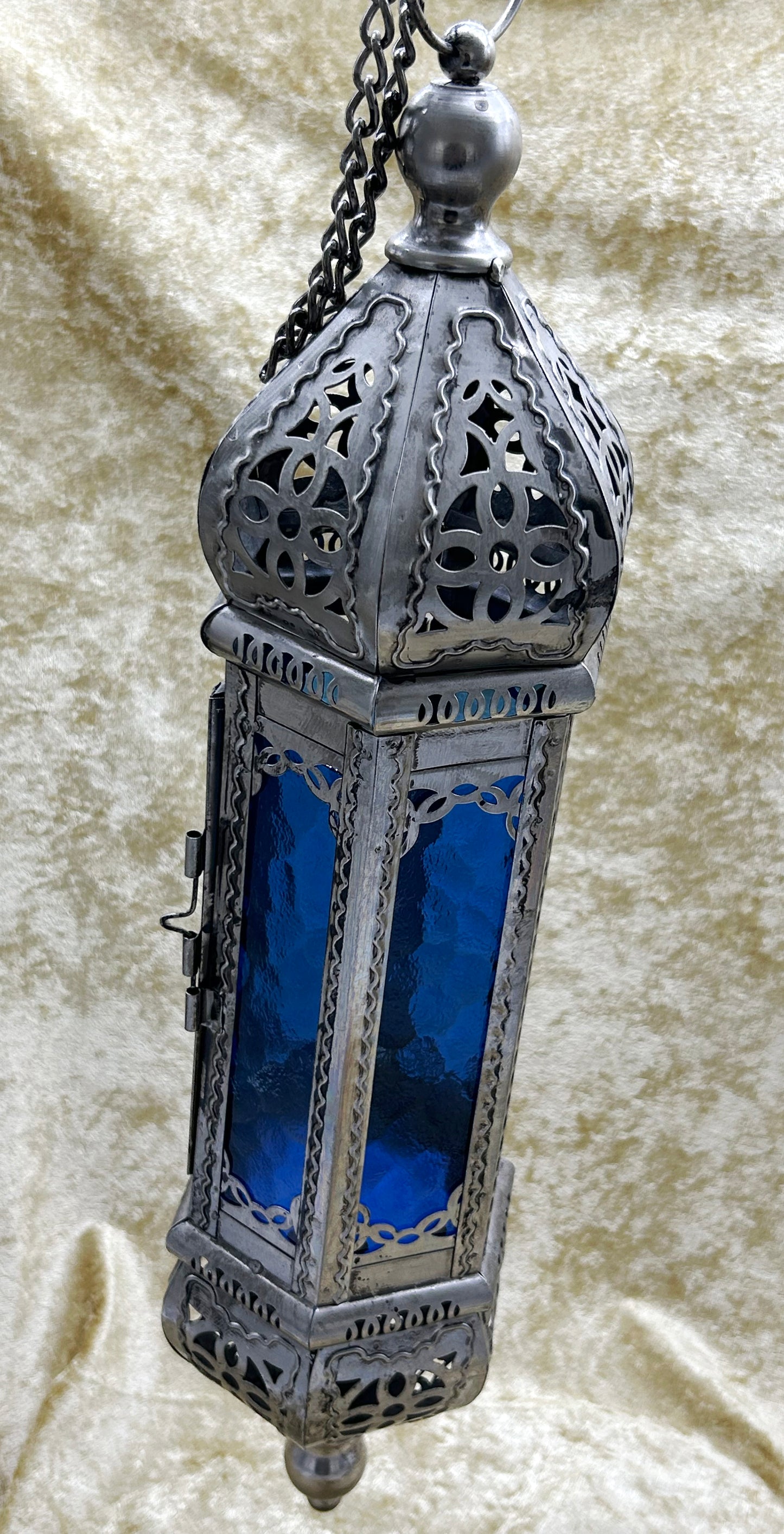 Moroccan pierced-metal hanging lantern with cobalt blue glass, full view with chain