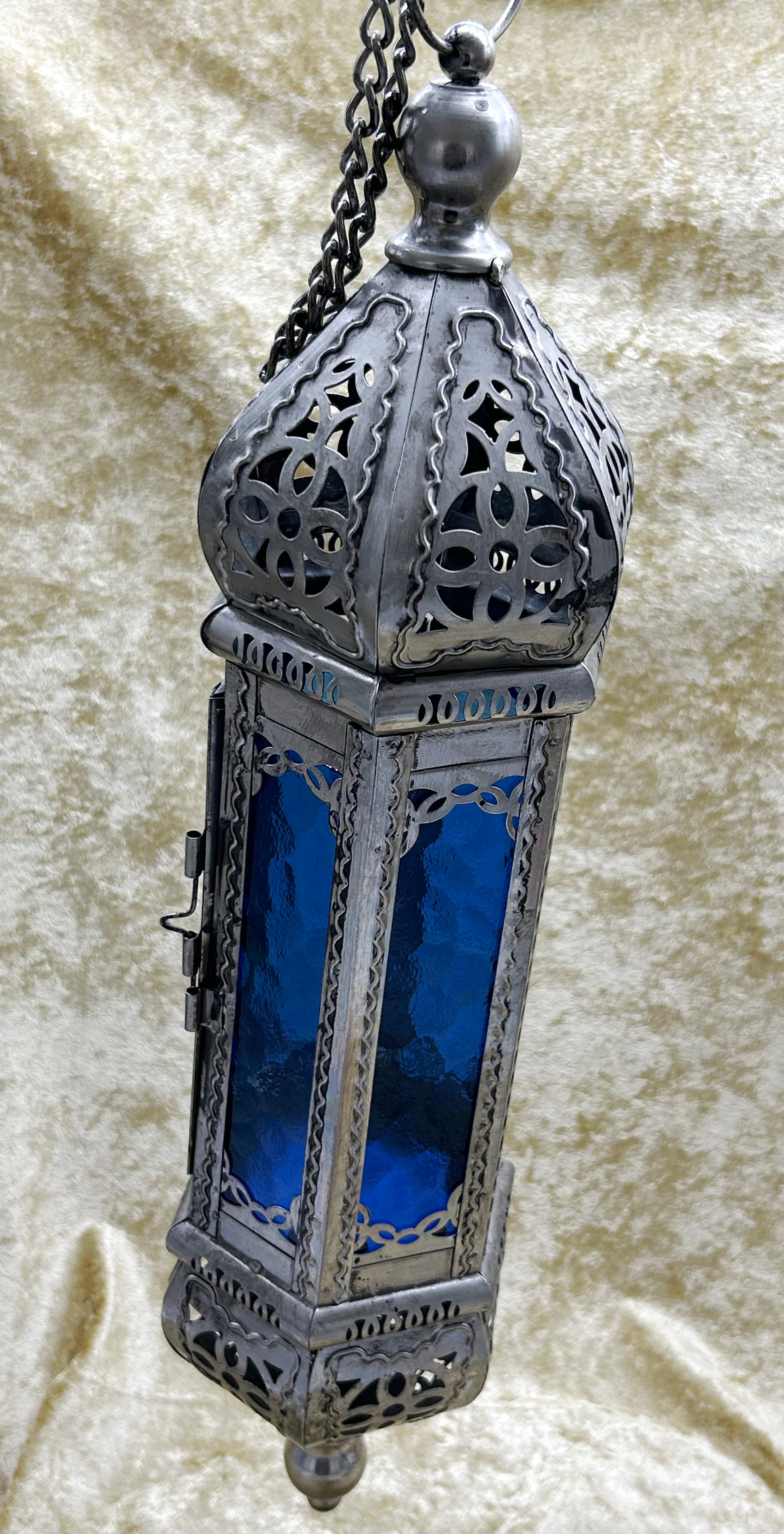 Moroccan pierced-metal hanging lantern with cobalt blue glass, full view with chain