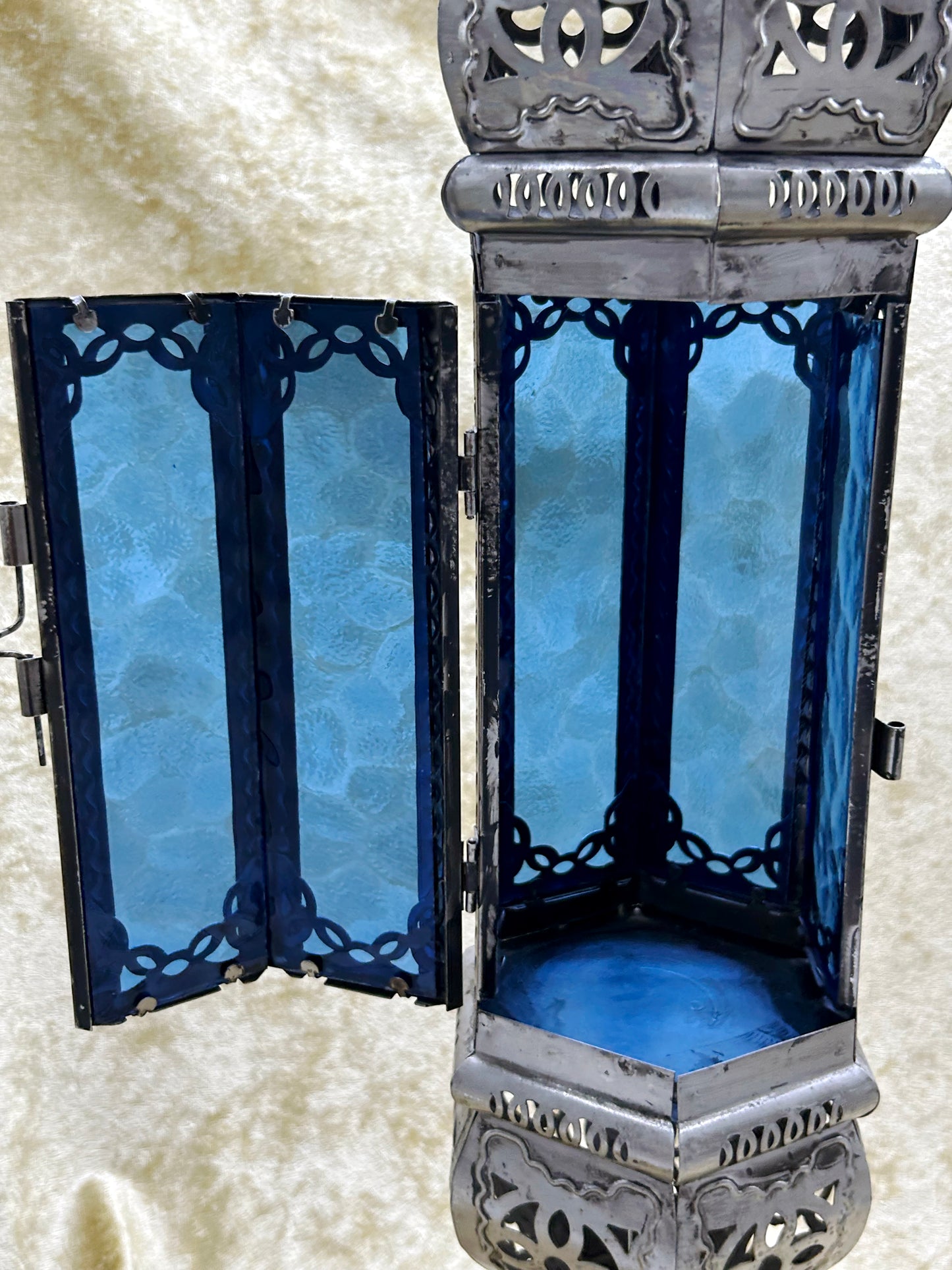 Interior of the lantern with door open showing cobalt blue glass panels
