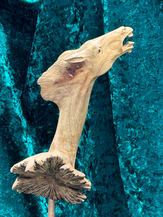 Antique Indonesian carved rootwood horse head sculpture on turned base, three-quarter view