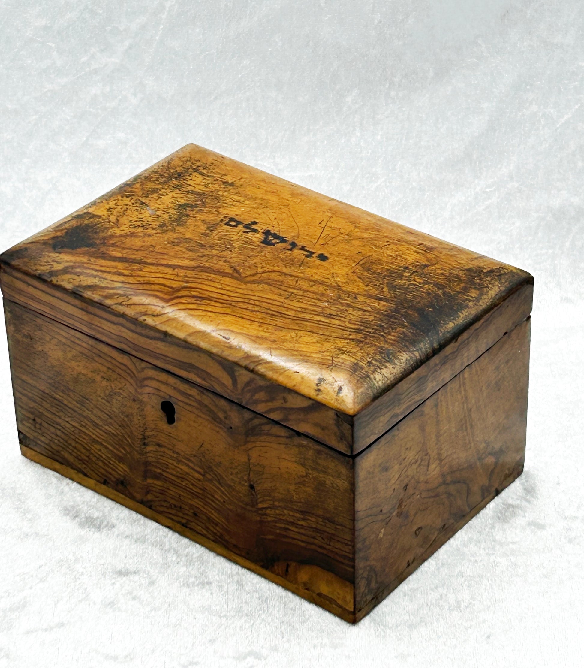 Holy Land olive wood casket, alternate three-quarter angle with rich honeyed patina