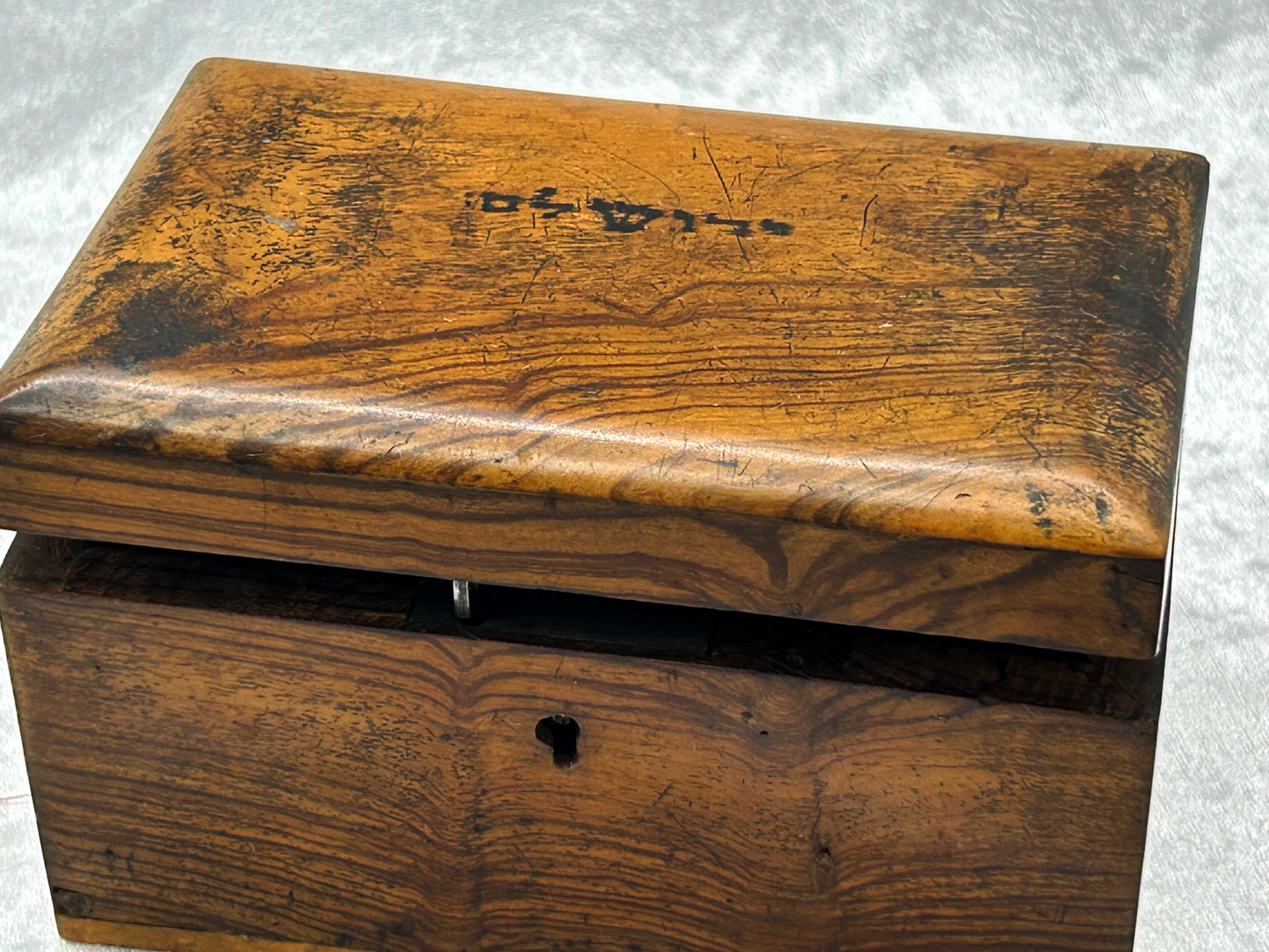 Olive wood box with lid ajar showing brass hinge mechanism