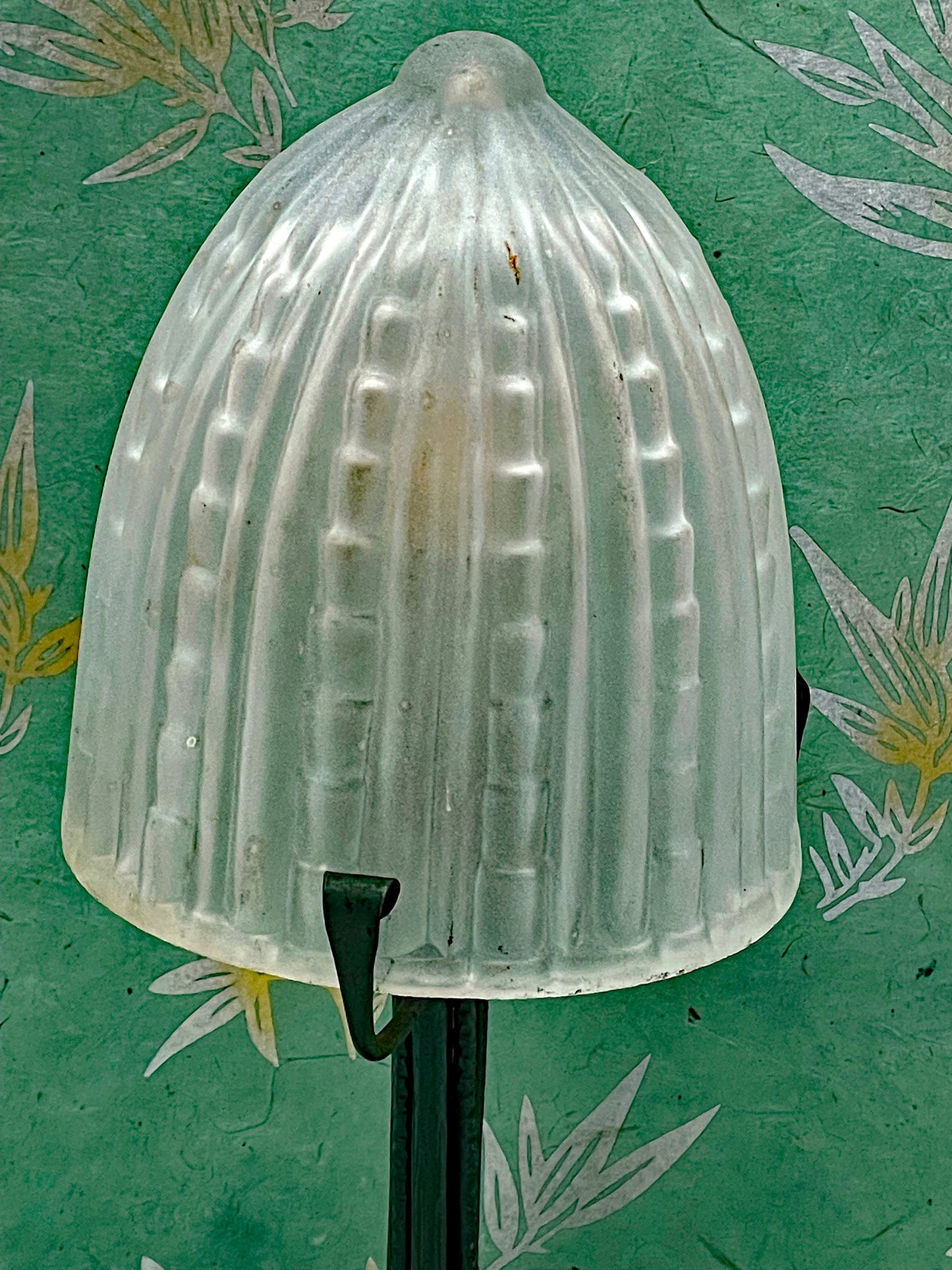 Hand-forged iron base with ivy-leaf decoration
