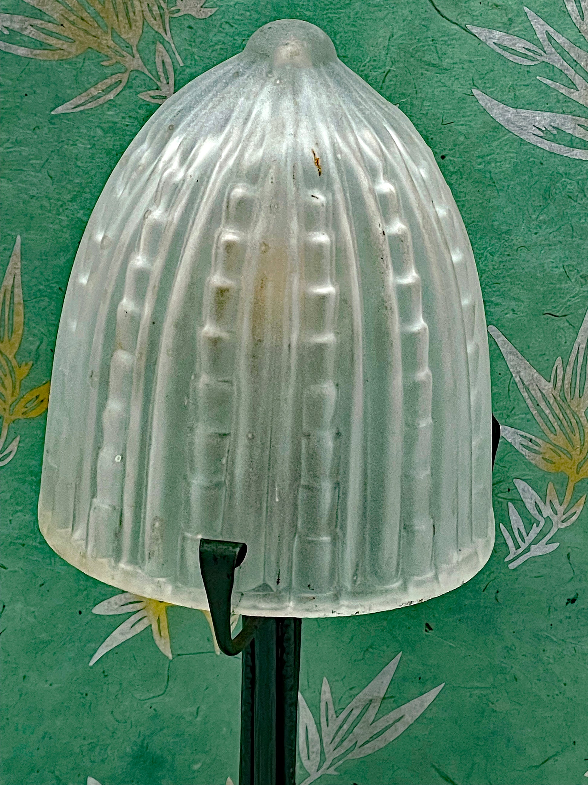 Hand-forged iron base with ivy-leaf decoration
