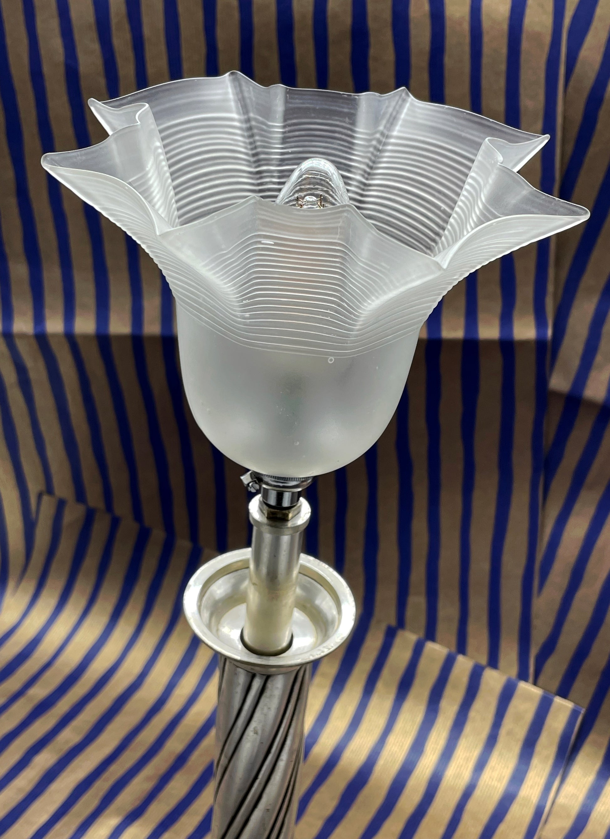 Silvered metal floor lamp detail