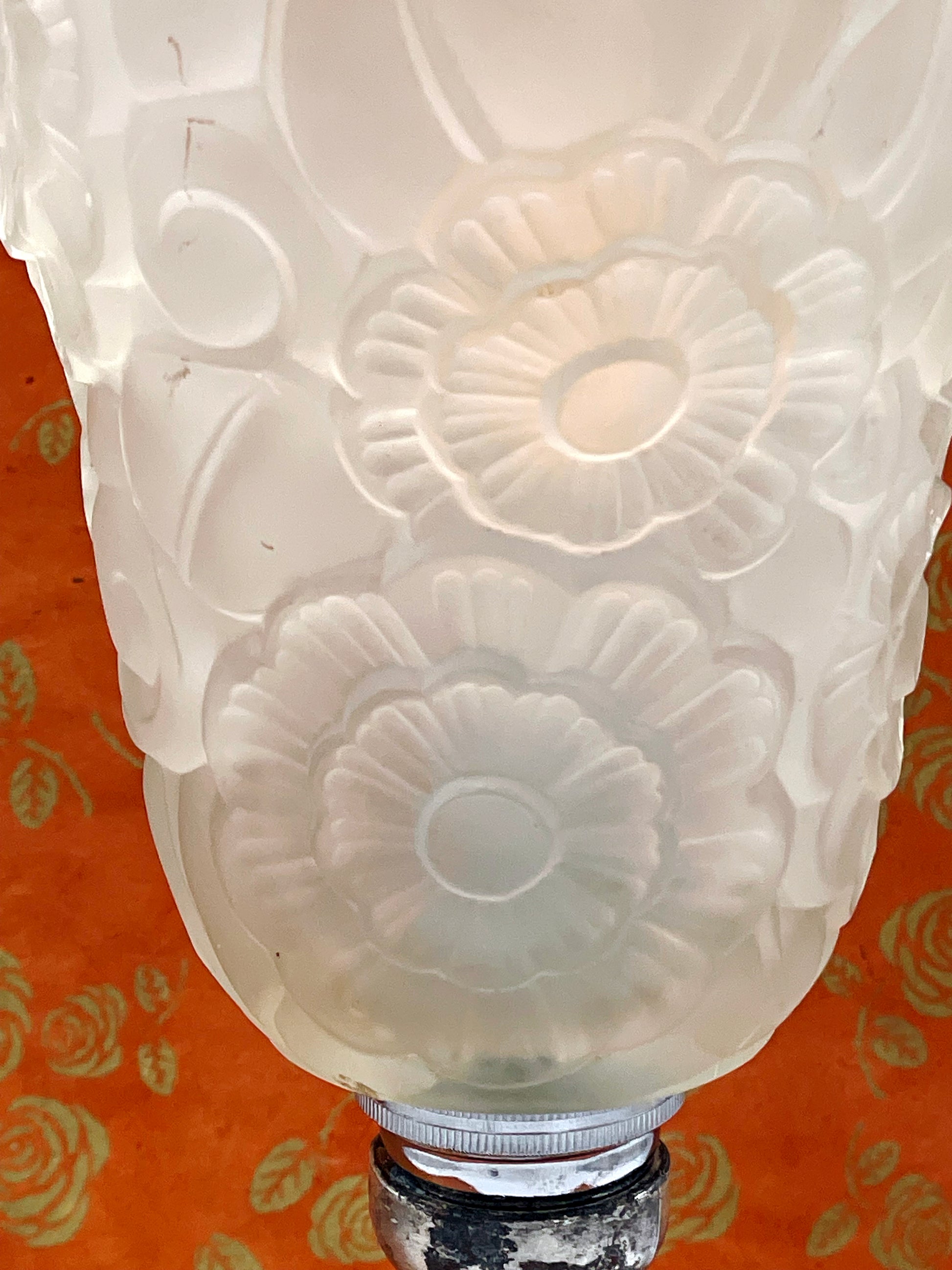 Detail of the silvered metalwork and glass shade