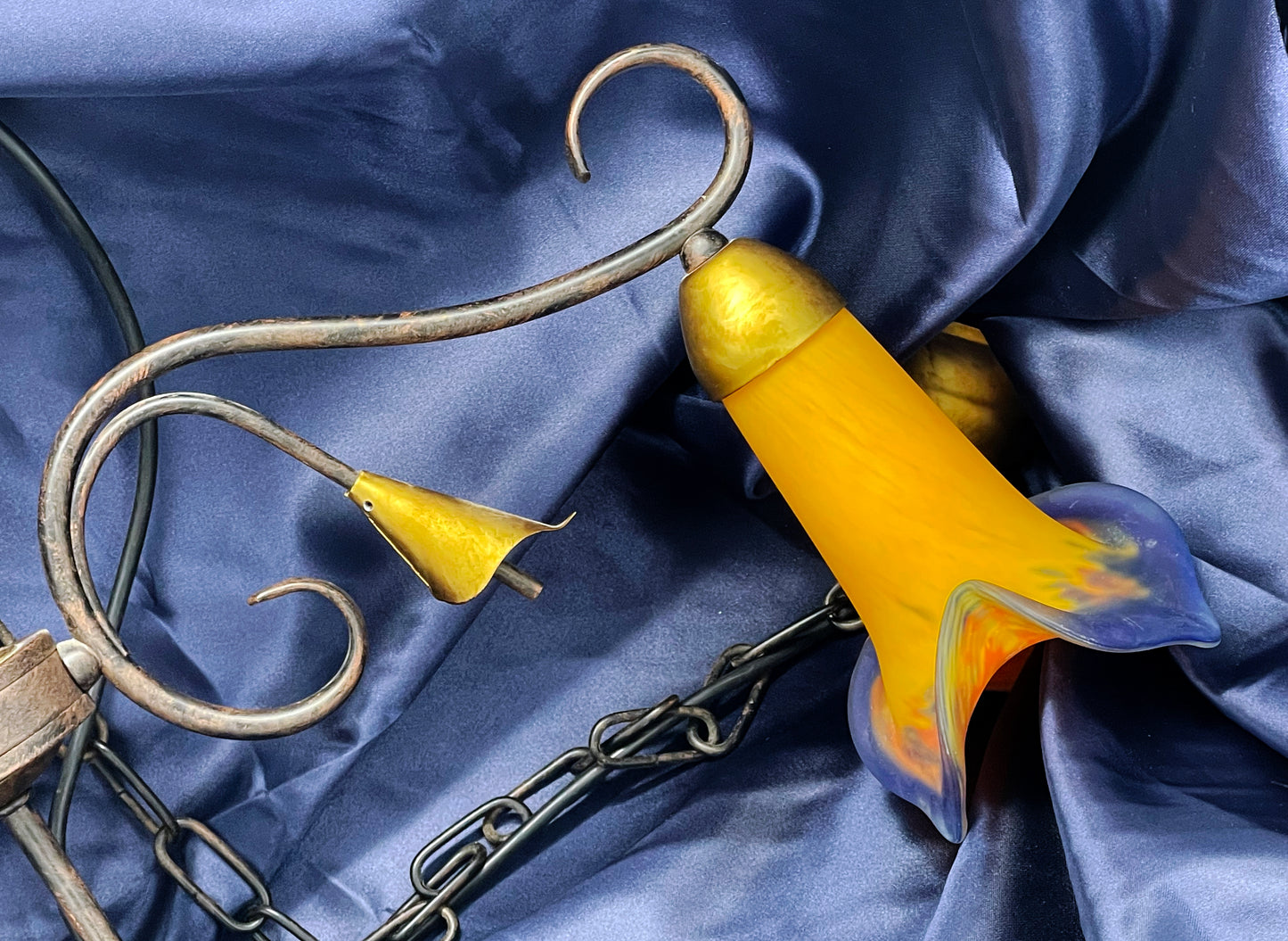 Detail of tulip shade opening and brass fitting