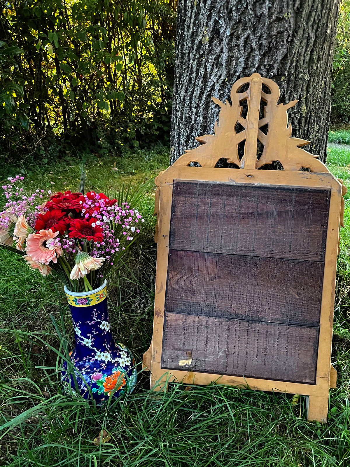 Reverse of the antique mirror showing original wooden planks and hand forged nails