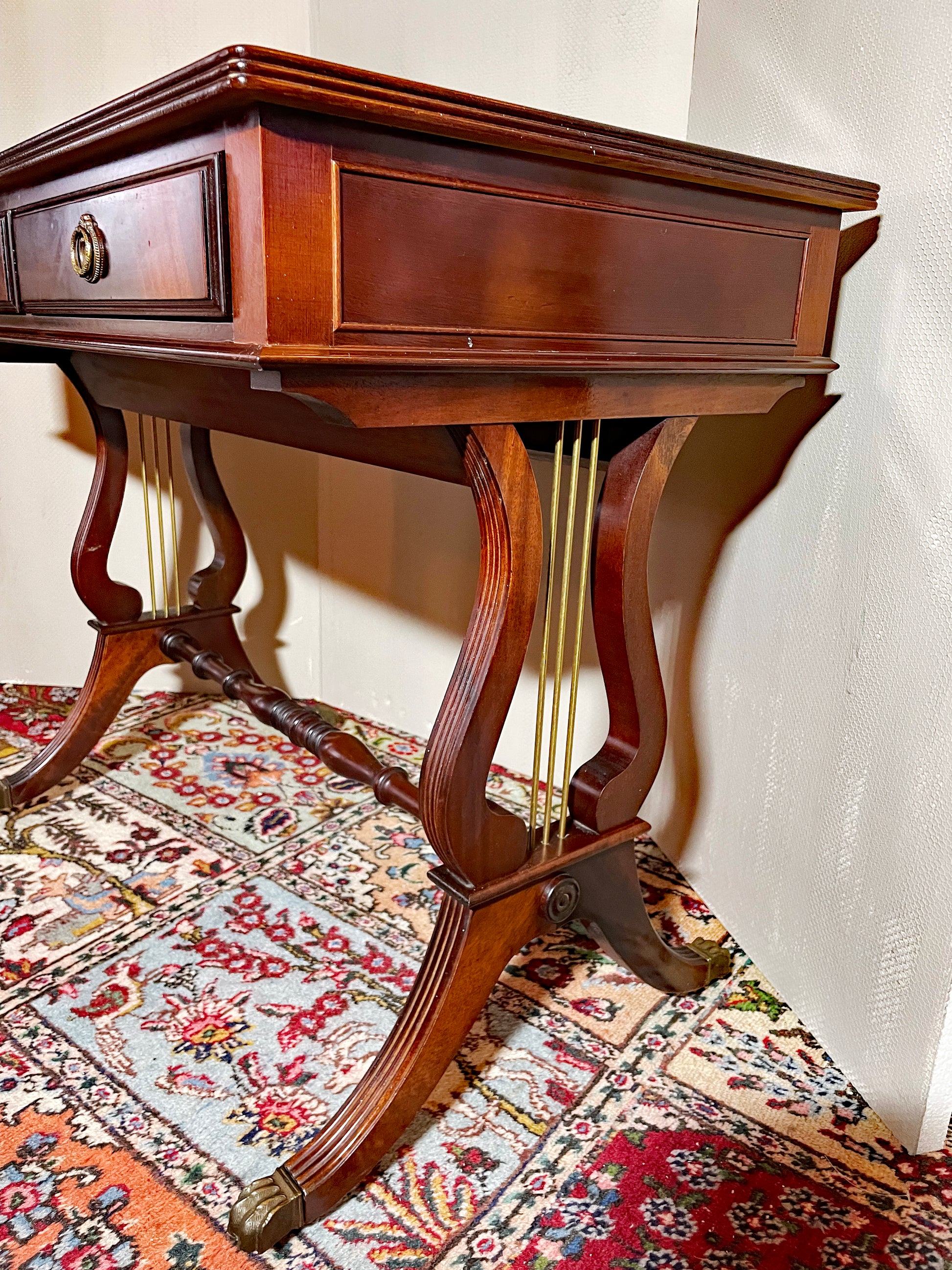 Regency-style mahogany console table showing lyre-form ends and brass stringing, opposite angle