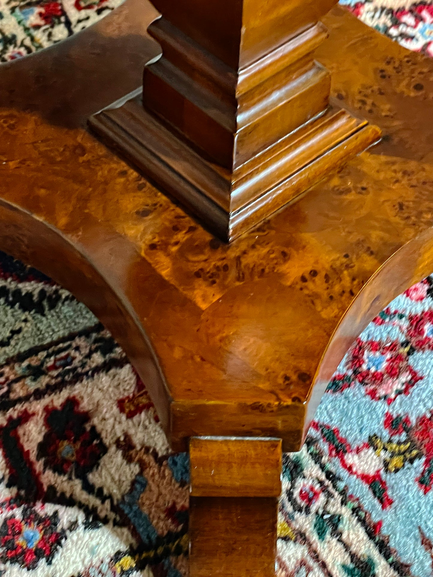 Plinth and scrolled foot detail of the burl wood side table