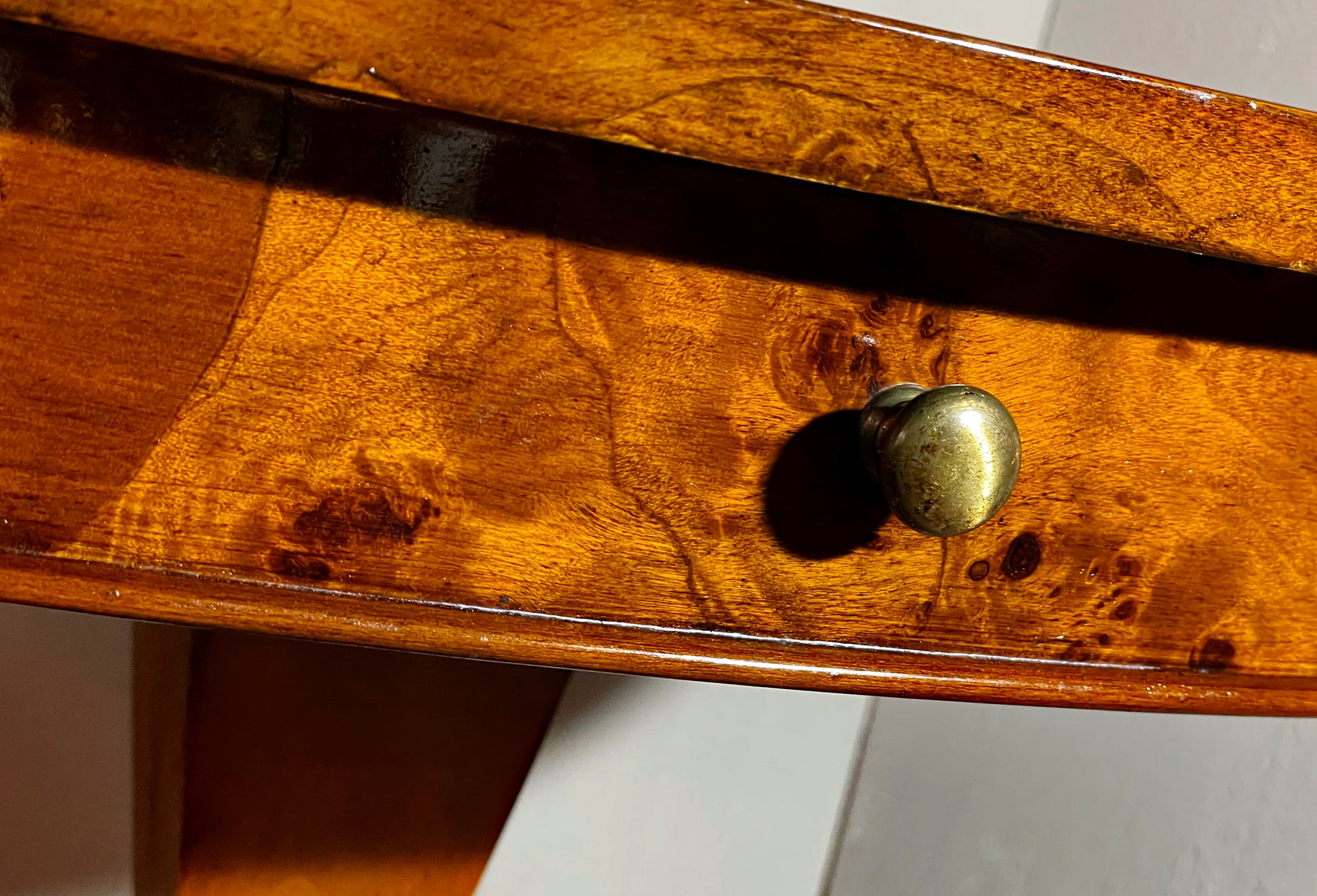 Single frieze drawer shown open on the oval side table