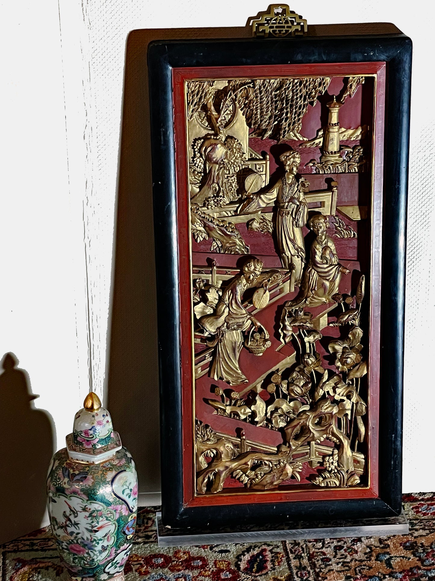 Detail of carved gilt figures on Chinese decorative panel