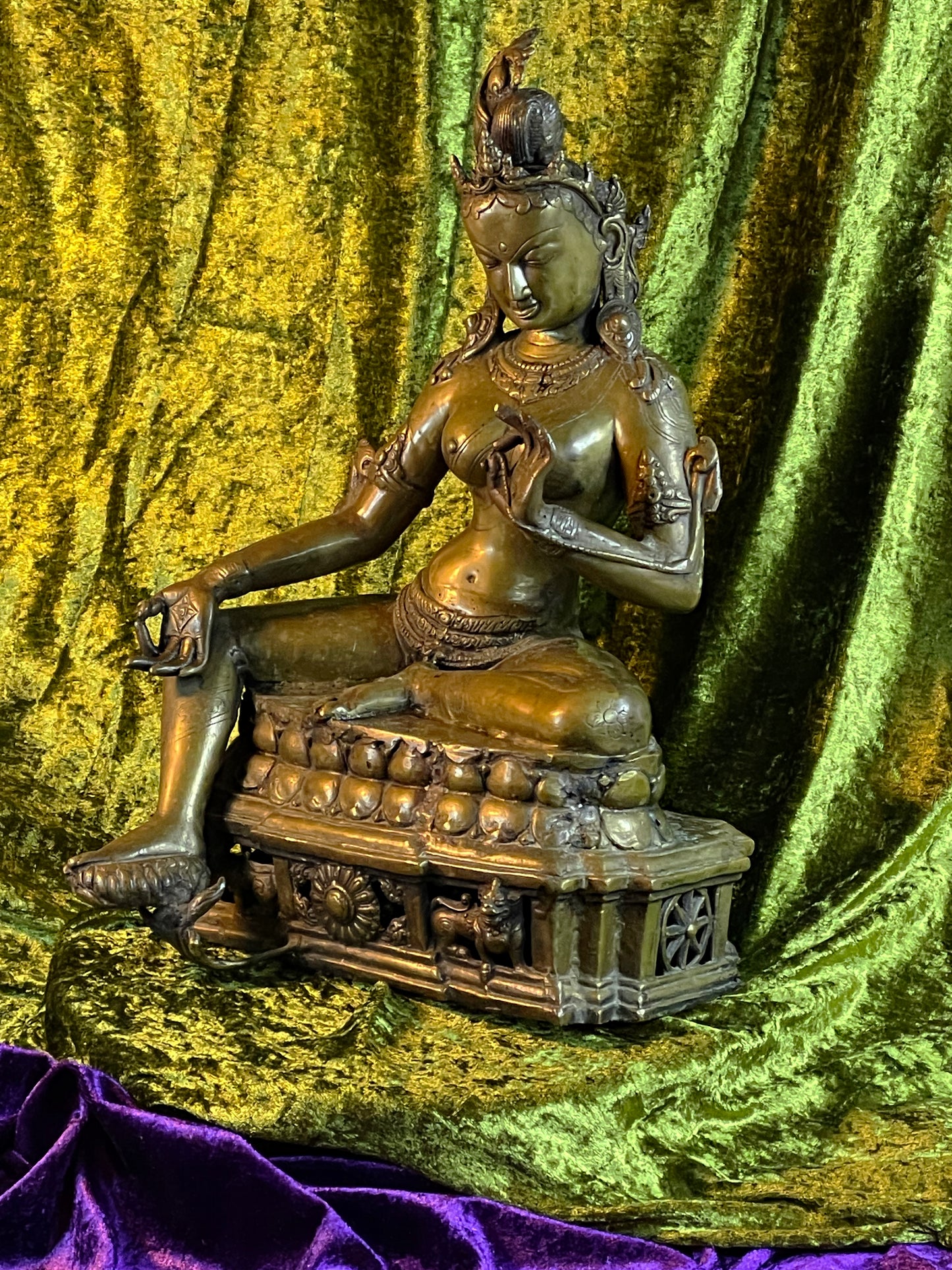 Antique Tibetan bronze Green Tara statue seated in royal ease on a lotus throne, three quarter view, 41 cm