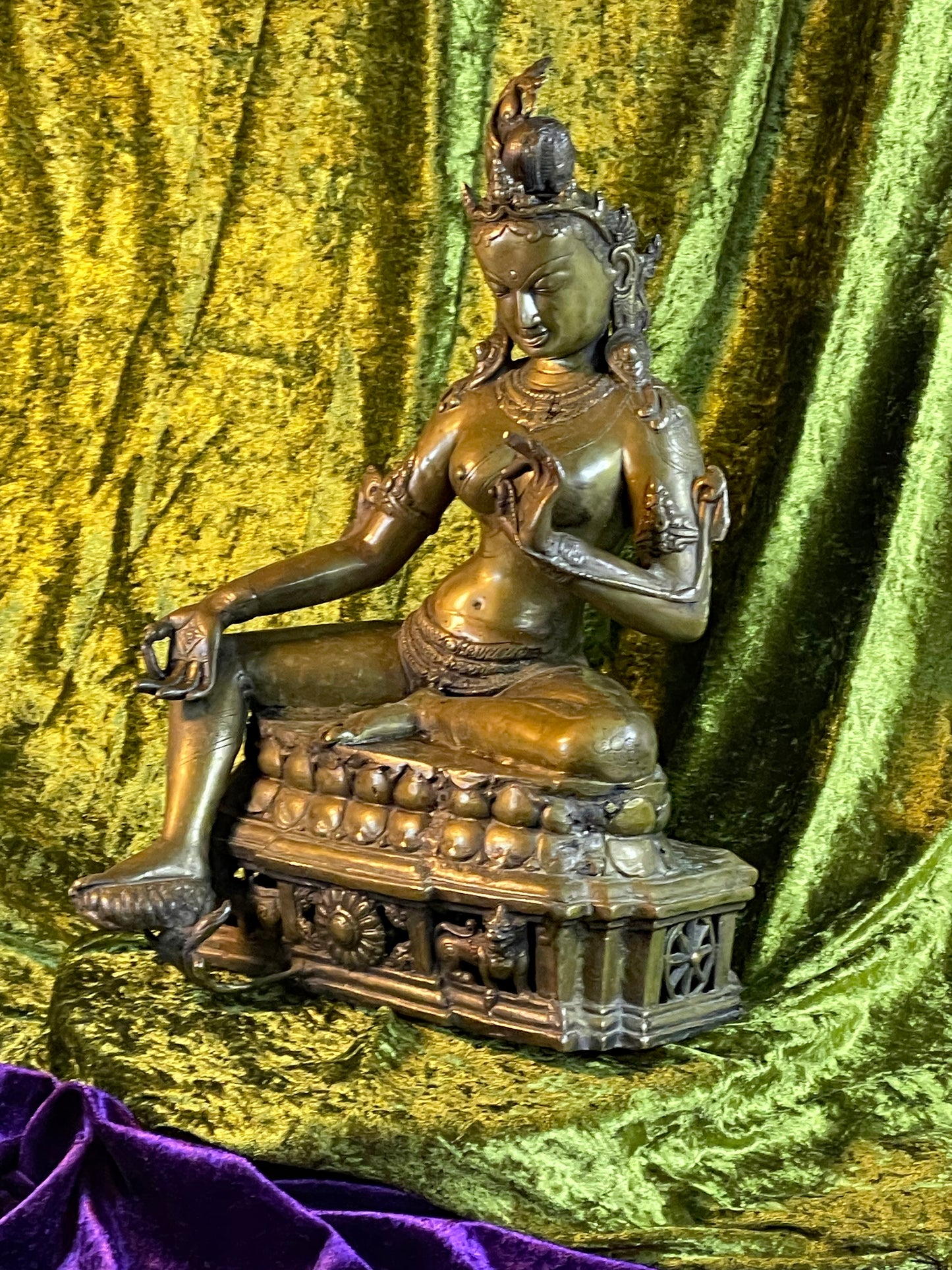 Left three quarter view of the seated Green Tara bronze bodhisattva