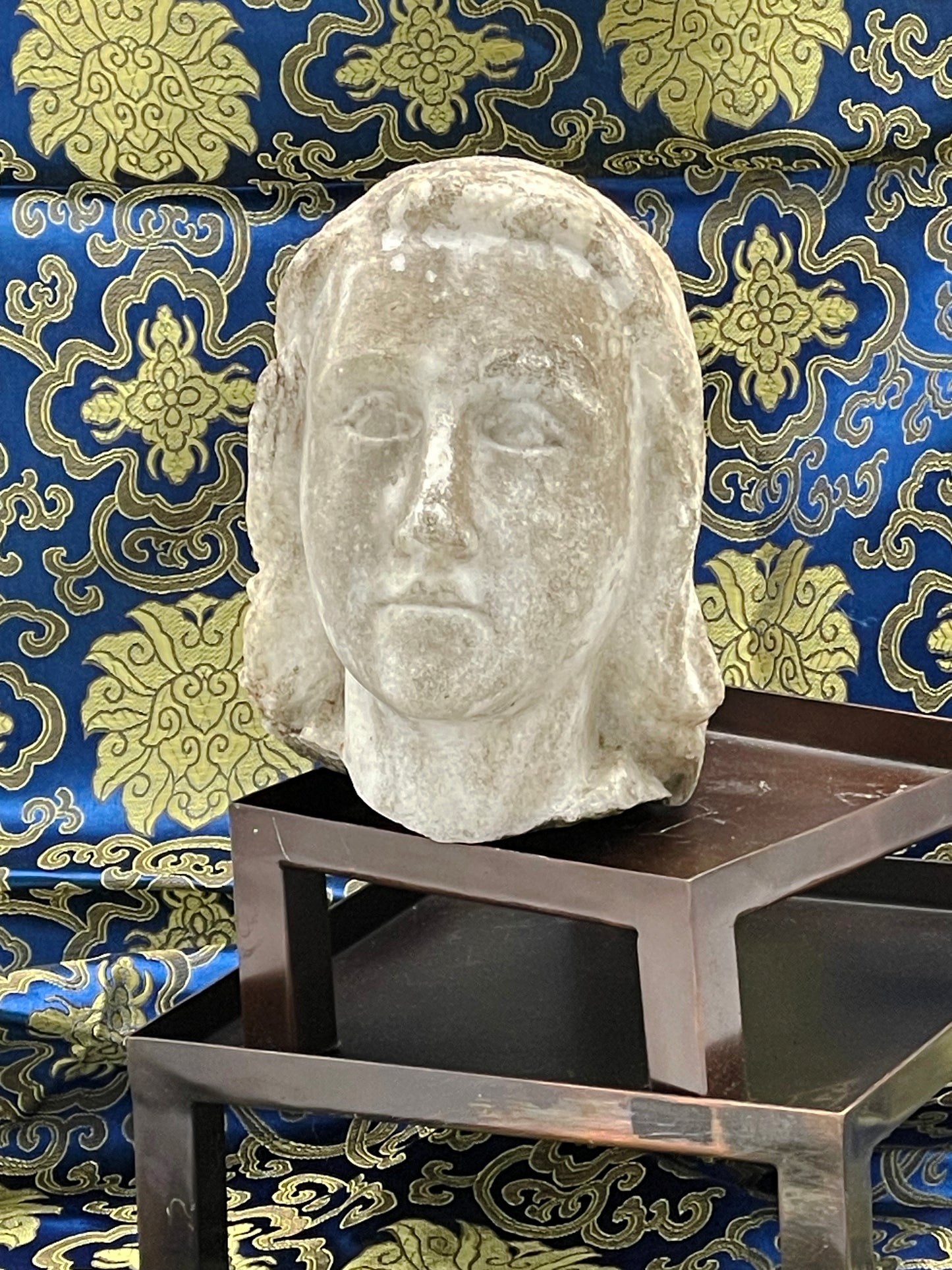 Three quarter view of French marble cherub head