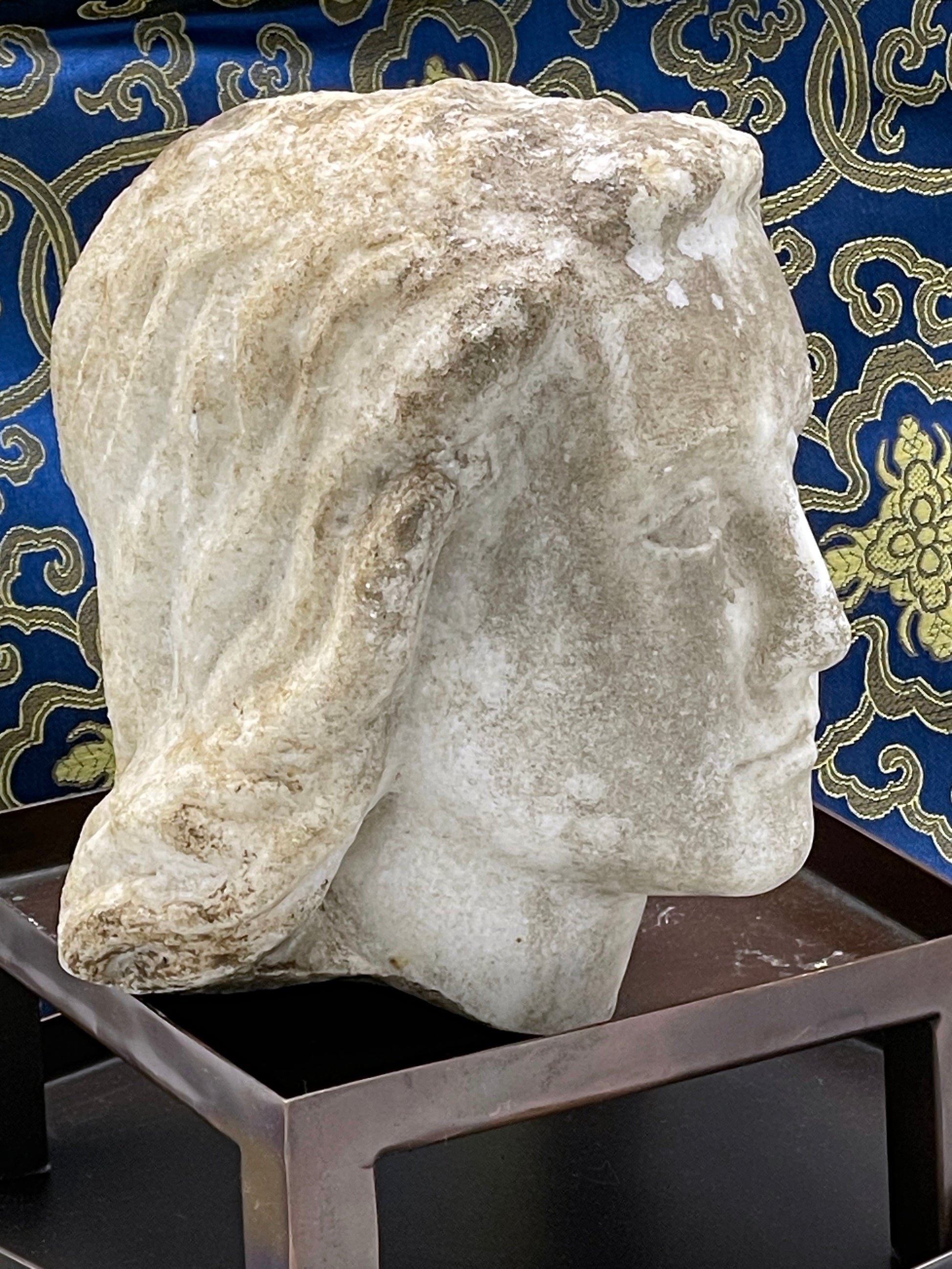 Rear view of marble angel head sculpture